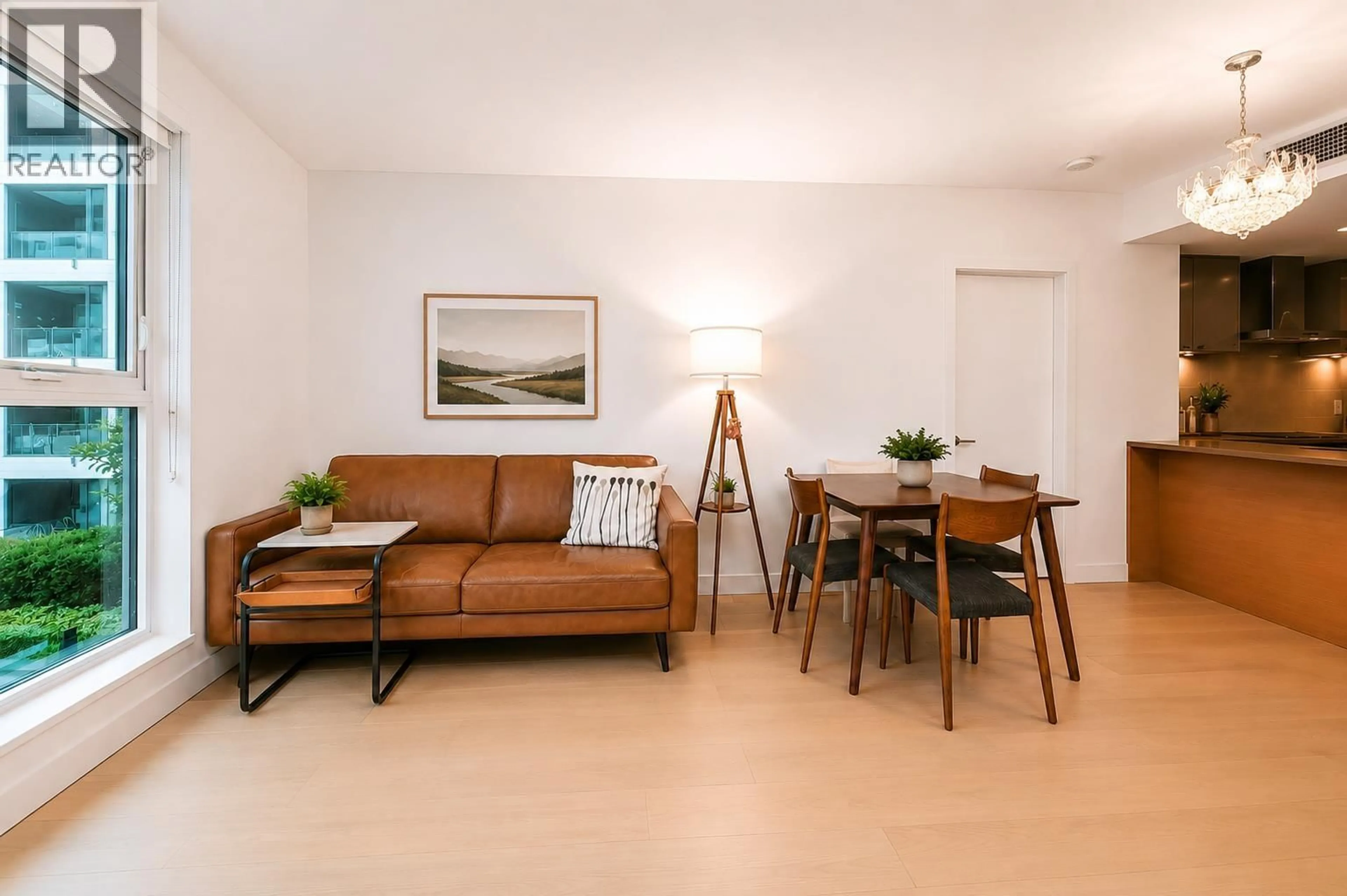 Living room with furniture, wood/laminate floor for 311 - 7228 ADERA STREET, Vancouver British Columbia V6P0H8