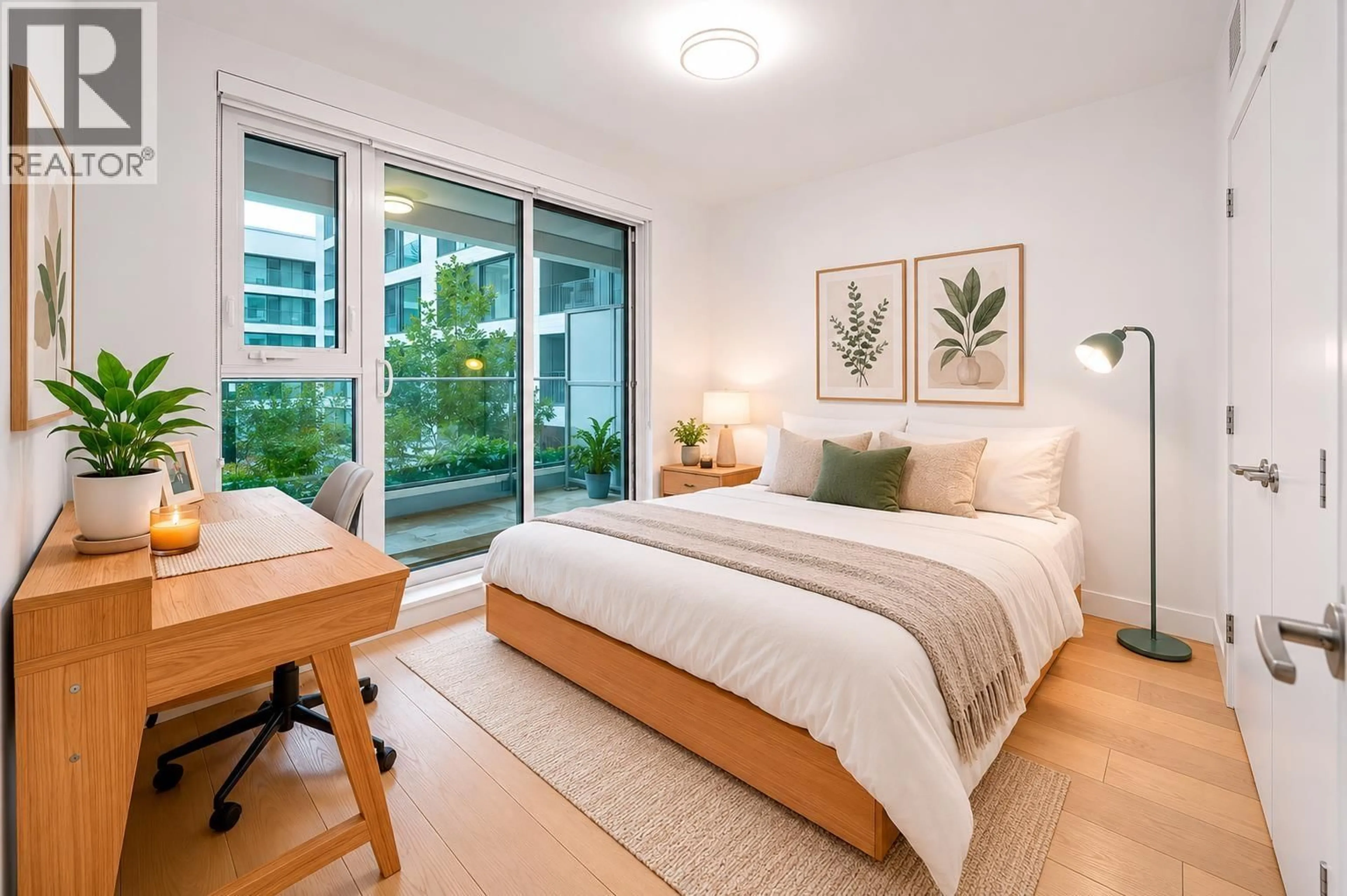 Bedroom with bed, wood/laminate floor for 311 - 7228 ADERA STREET, Vancouver British Columbia V6P0H8