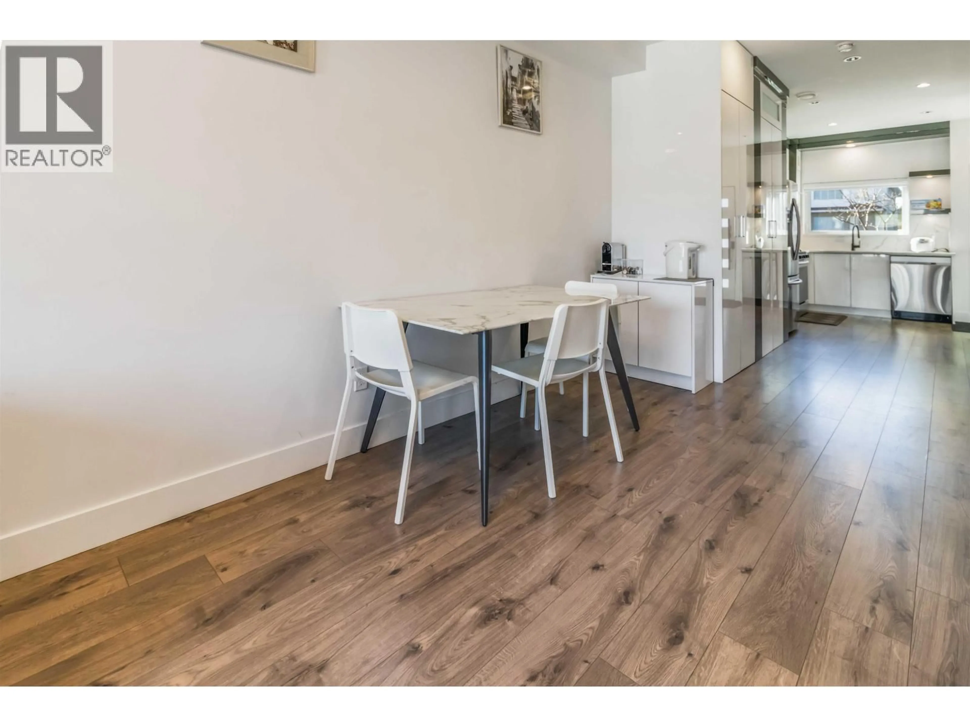 Dining room, wood/laminate floor for 102 - 7088 SPERLING AVENUE, Burnaby British Columbia V5E2W3
