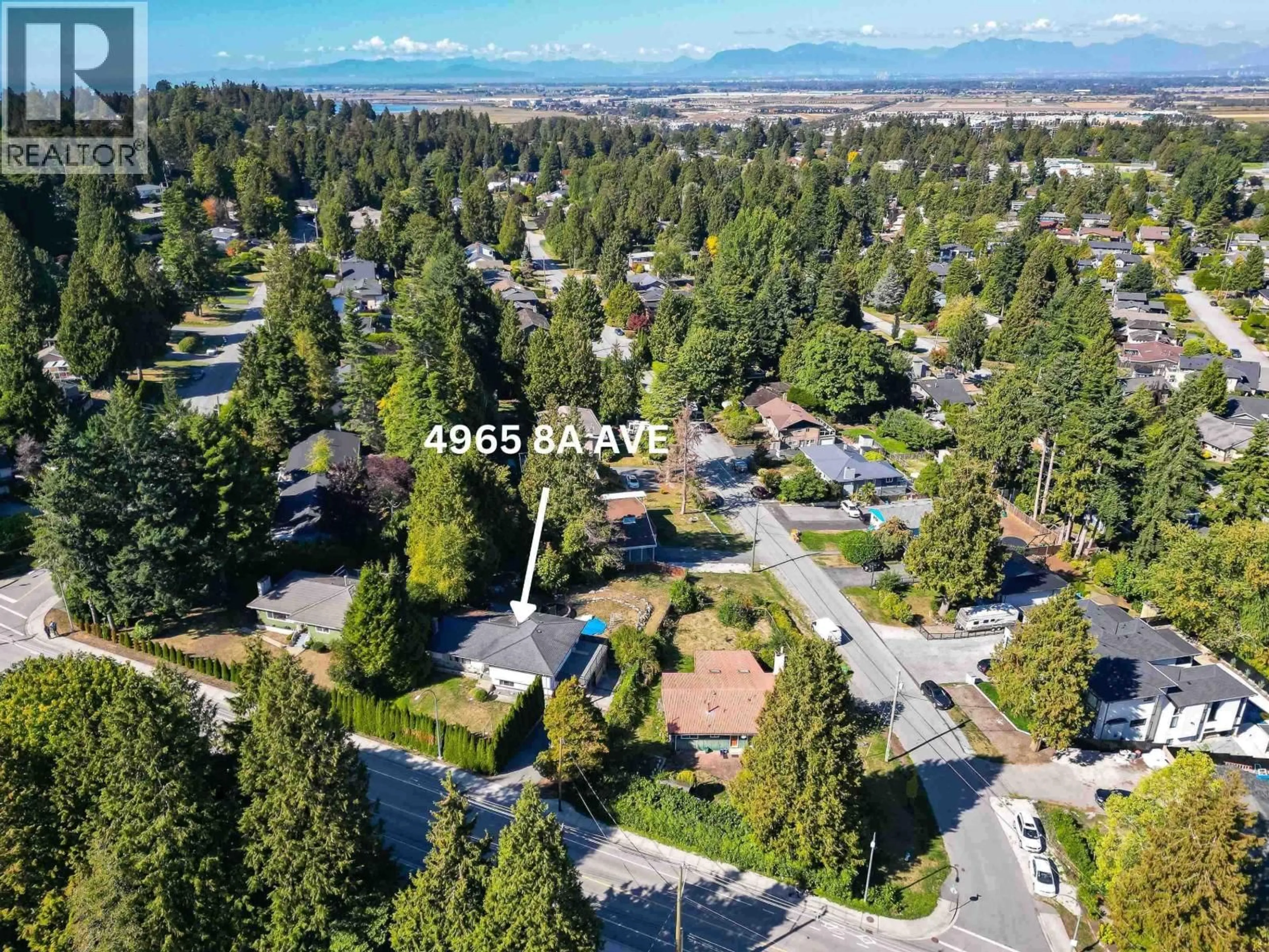 A pic from outside/outdoor area/front of a property/back of a property/a pic from drone, mountain view for 4965 8A AVENUE, Delta British Columbia V4M1T2