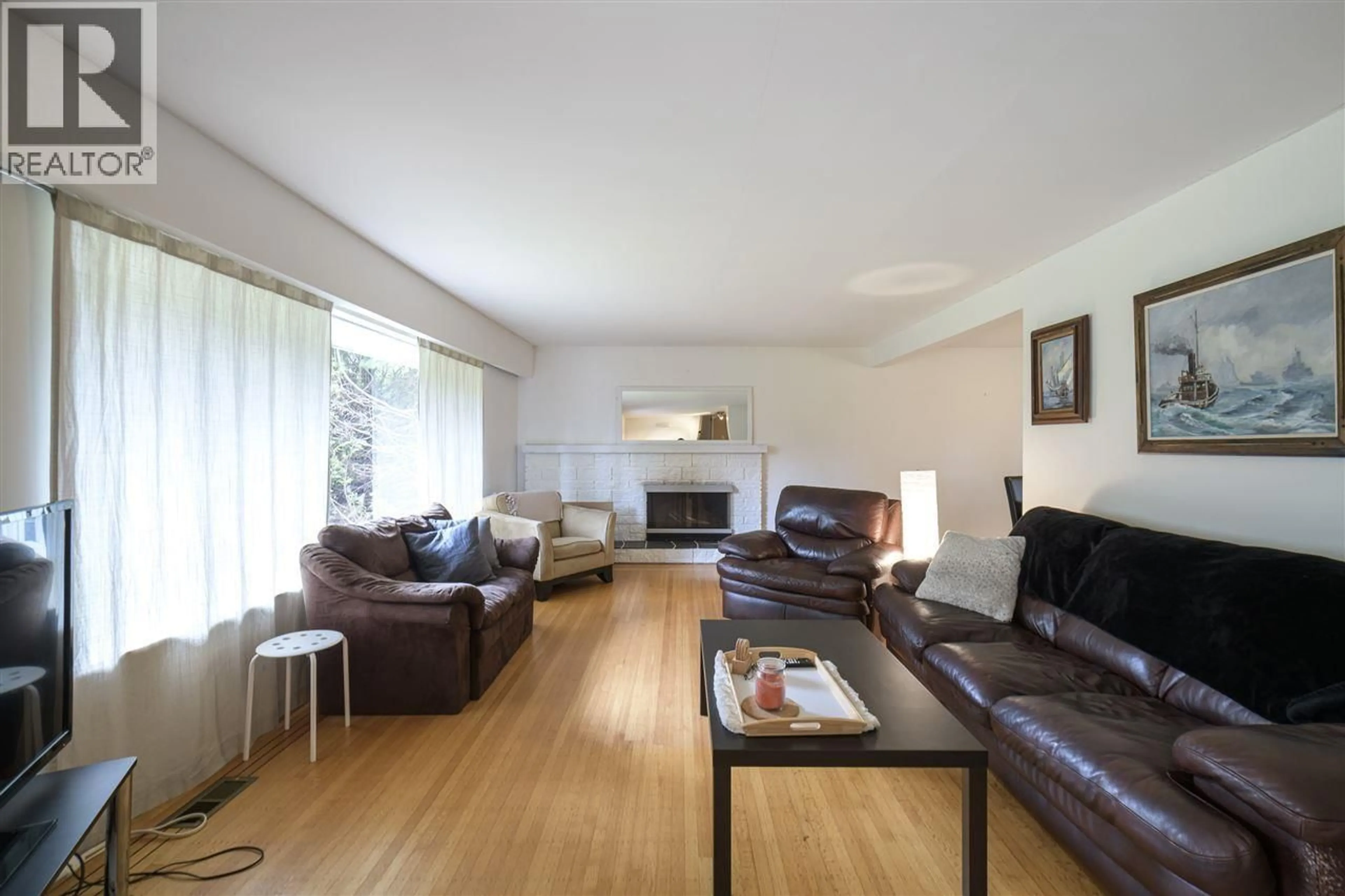 Living room with furniture, wood/laminate floor for 4965 8A AVENUE, Delta British Columbia V4M1T2