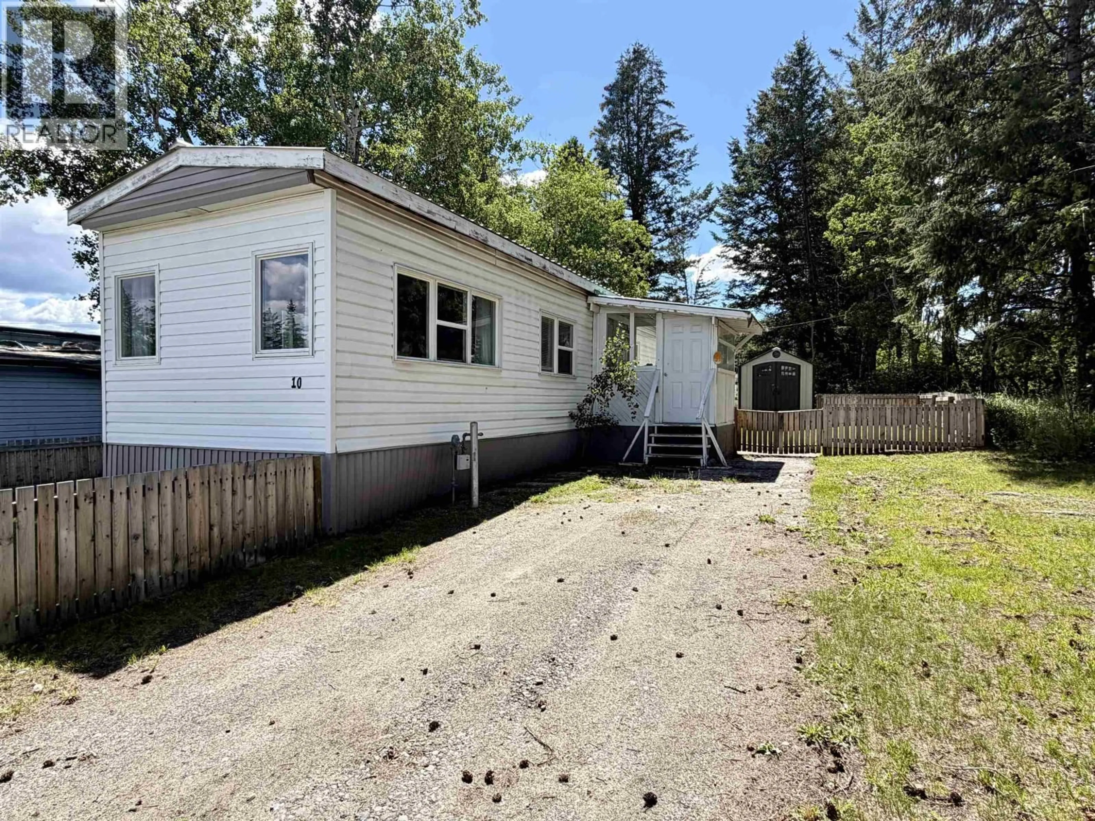 A pic from outside/outdoor area/front of a property/back of a property/a pic from drone, unknown for 10 - 5506 PARK DRIVE, 103 Mile House British Columbia V0K2E1