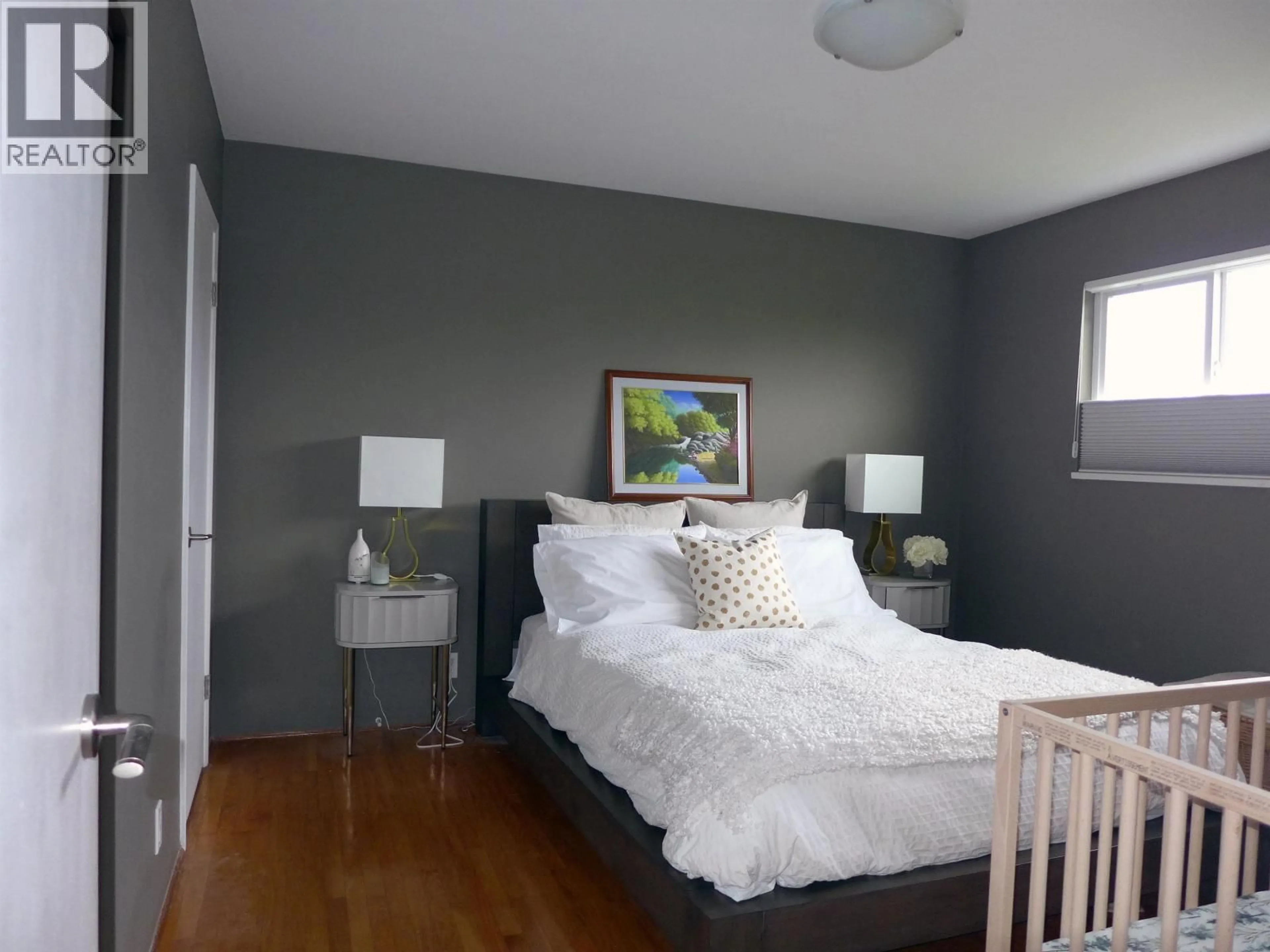 Bedroom with bed, wood/laminate floor for 3014 14TH AVENUE, Vancouver British Columbia V5M2J2