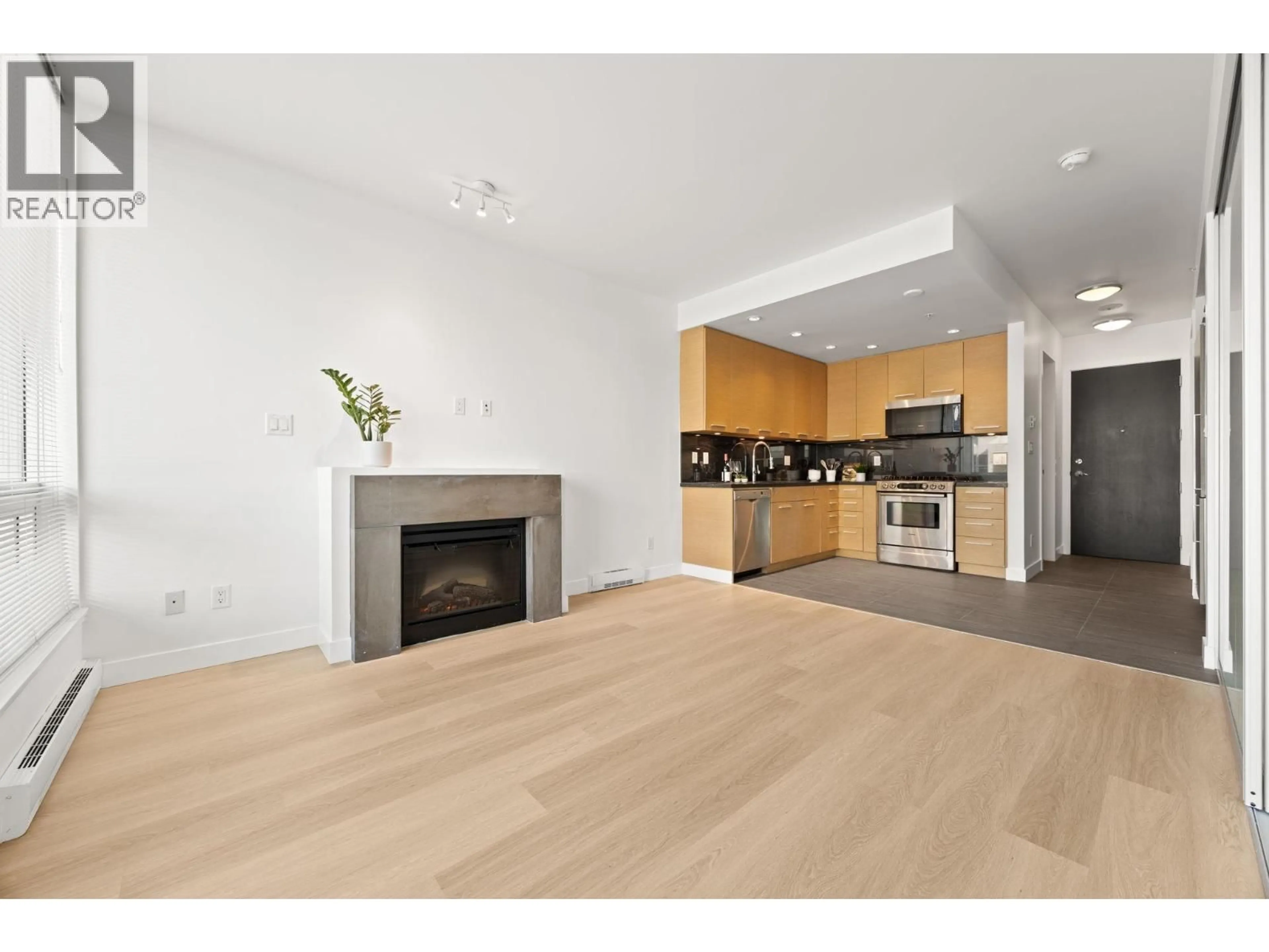 Open concept kitchen, wood/laminate floor for 408 - 2528 MAPLE STREET, Vancouver British Columbia V6J0B5