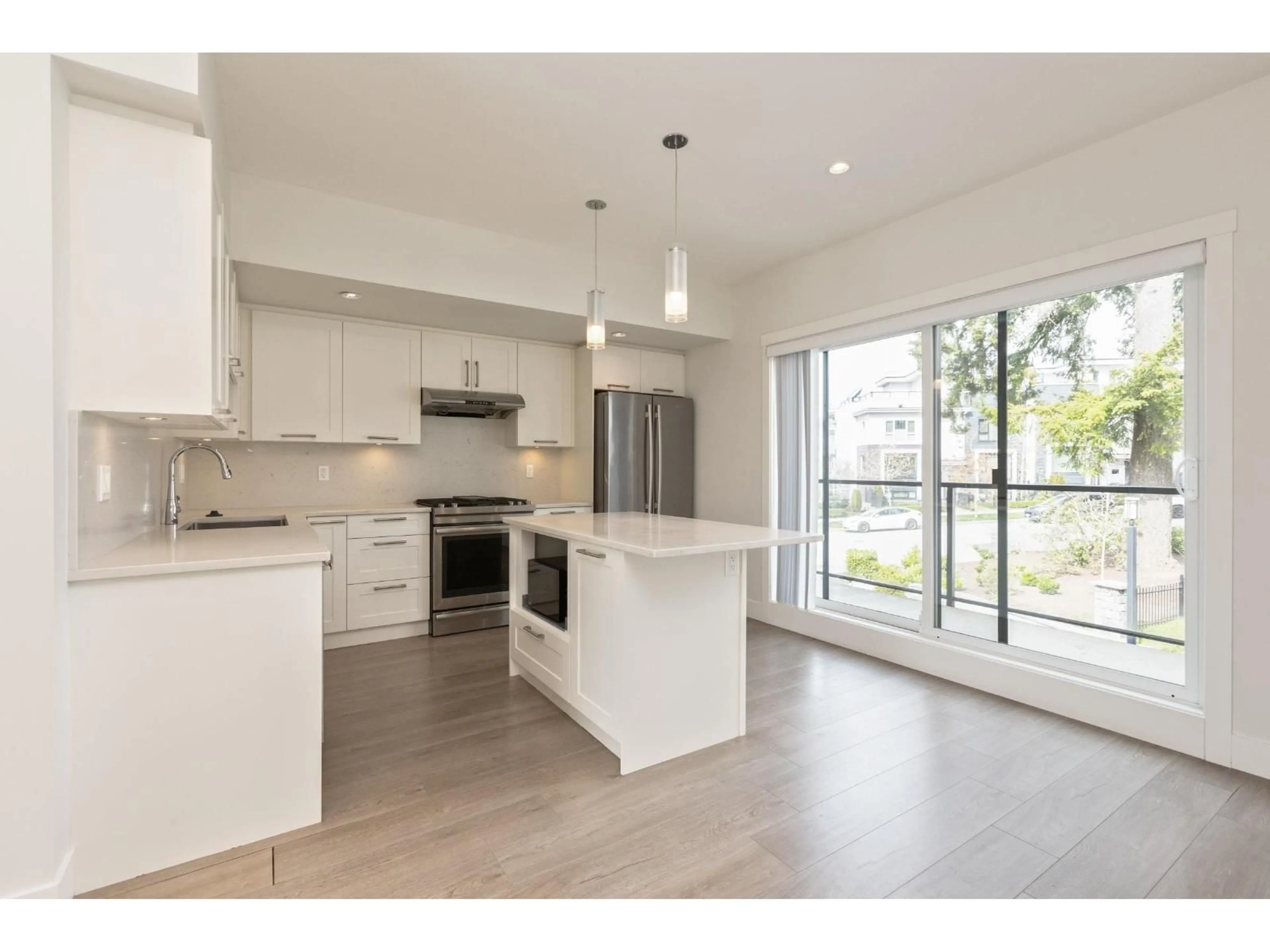 Open concept kitchen, wood/laminate floor for 232 - 2218 OAK MEADOWS DRIVE, Surrey British Columbia V3Z0W6