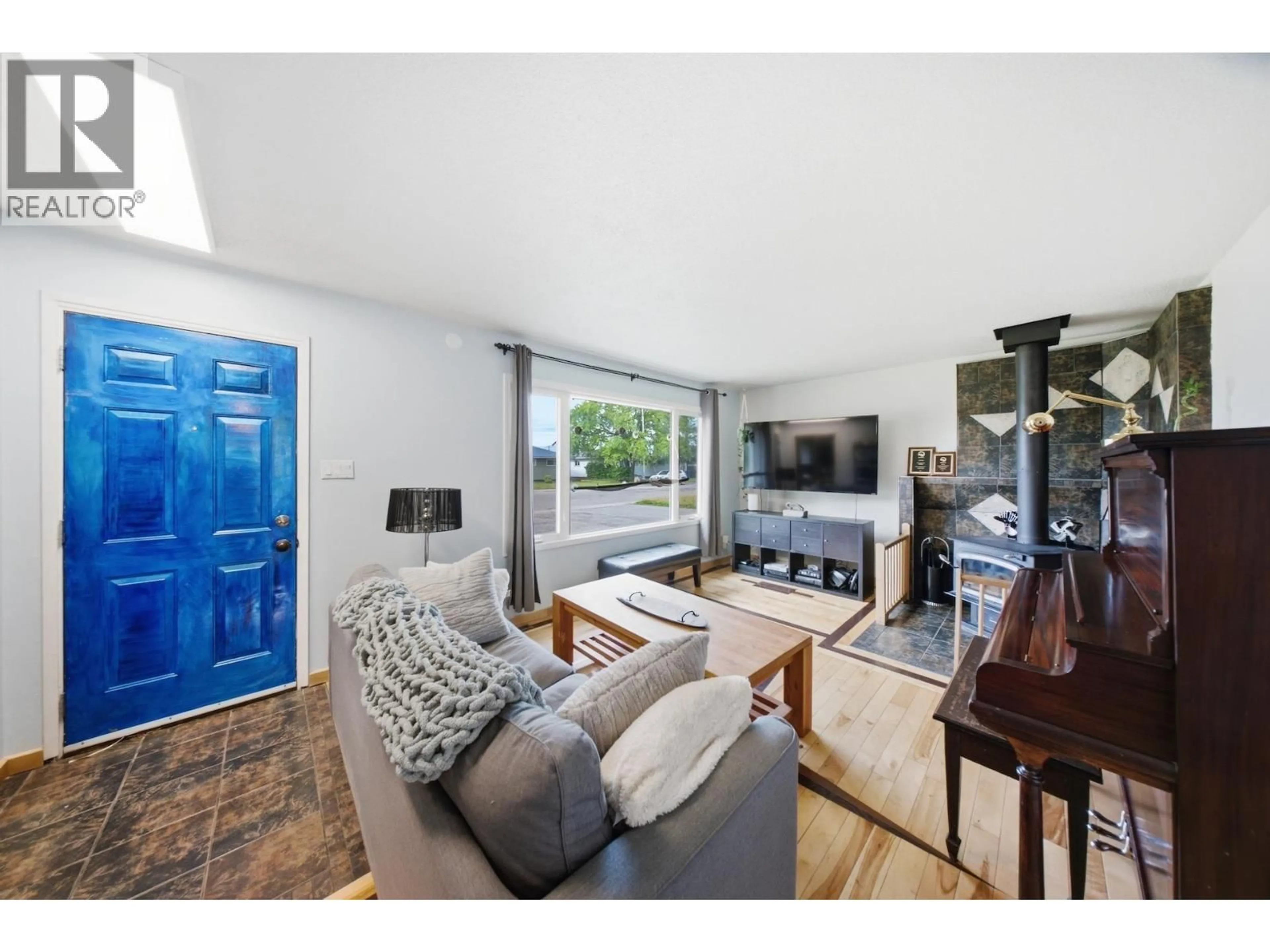 Living room with furniture, wood/laminate floor for 9708 105 AVENUE, Fort St. John British Columbia V1J2M1