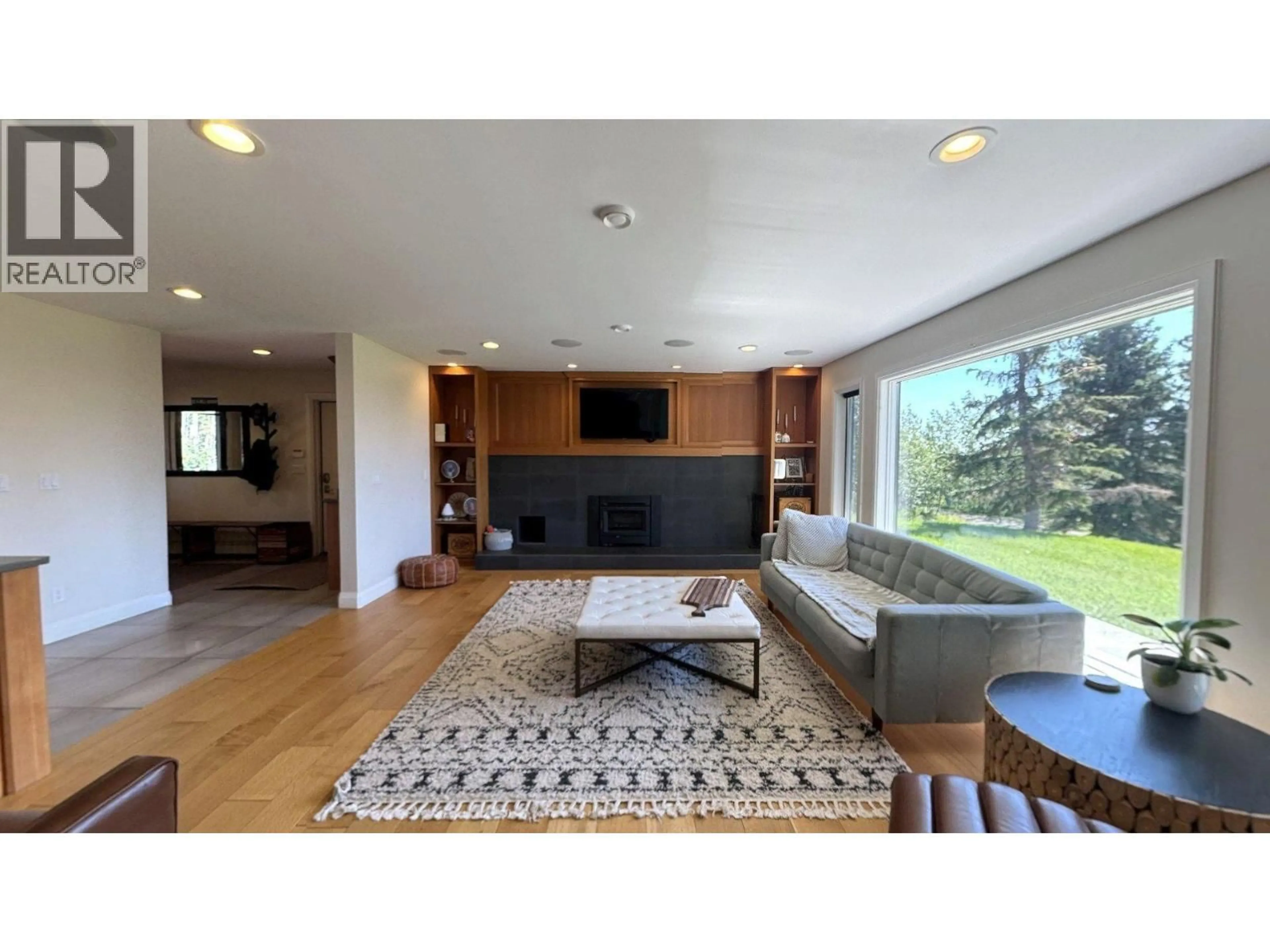 Living room with furniture, wood/laminate floor for 12583 267 ROAD, Fort St. John British Columbia V1J8J7