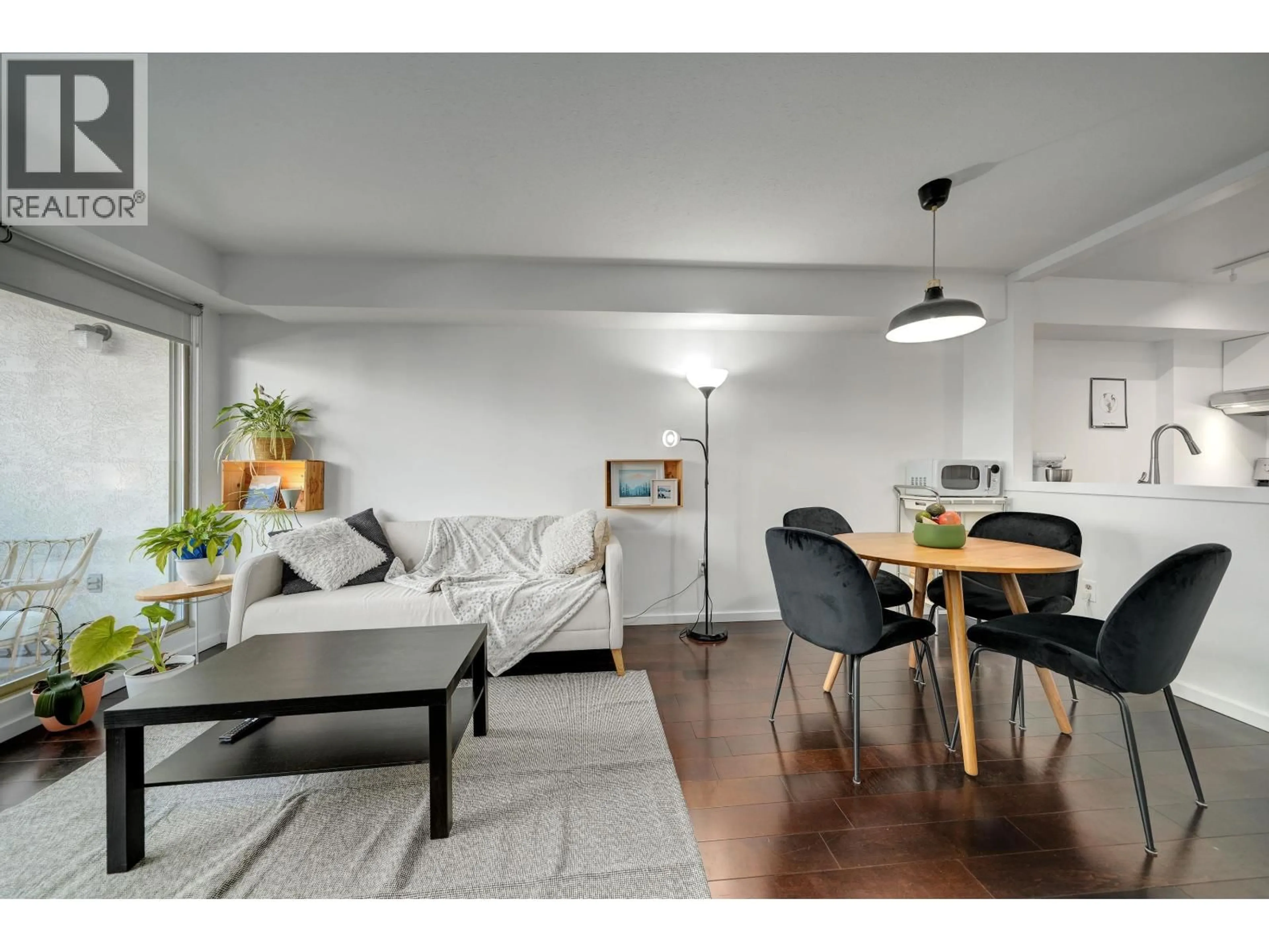 Living room with furniture, wood/laminate floor for 210 - 1099 BROADWAY, Vancouver British Columbia V5T1Y5