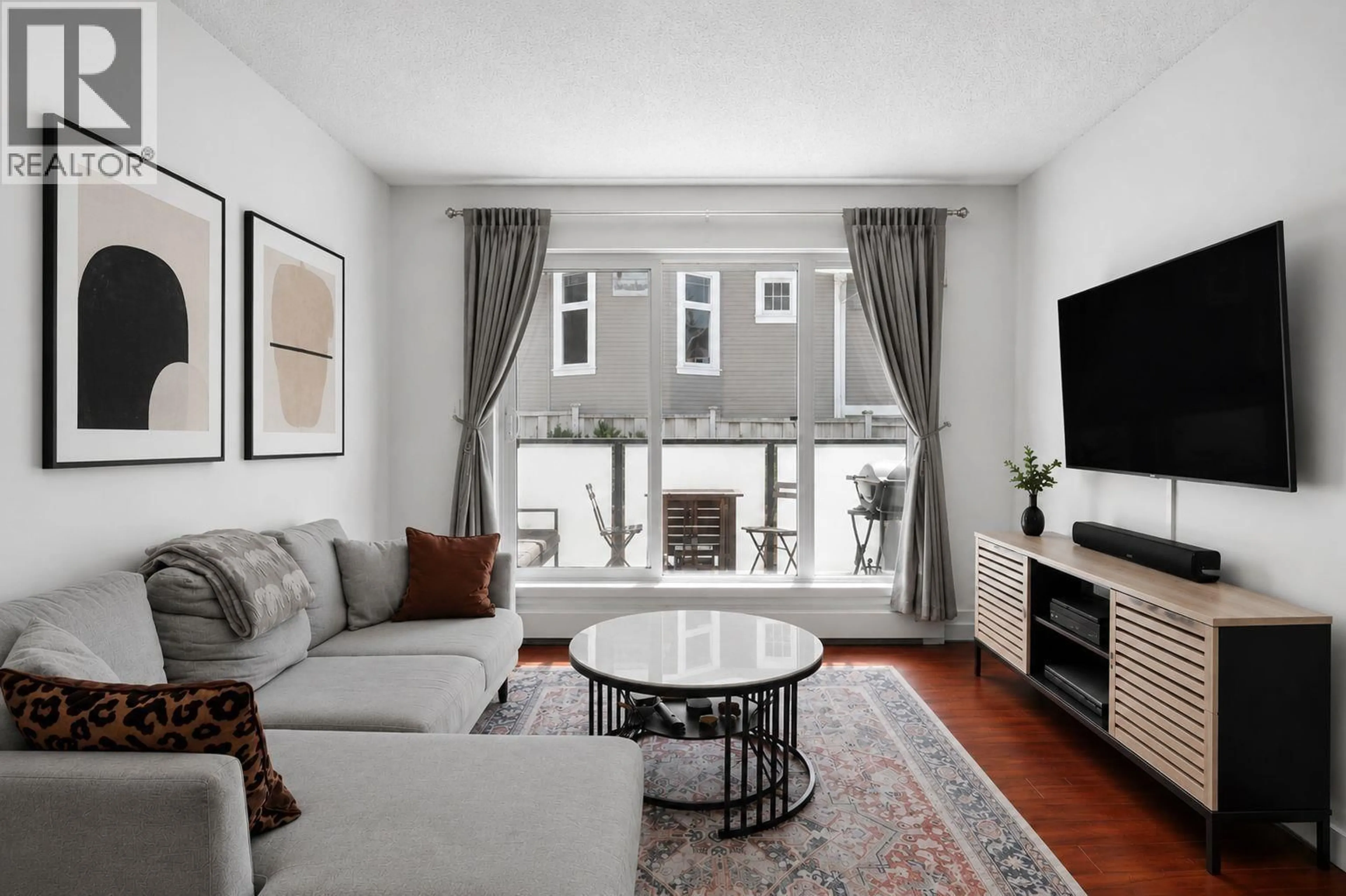 Living room with furniture, unknown for 202 - 2328 OXFORD STREET, Vancouver British Columbia V5L1G3