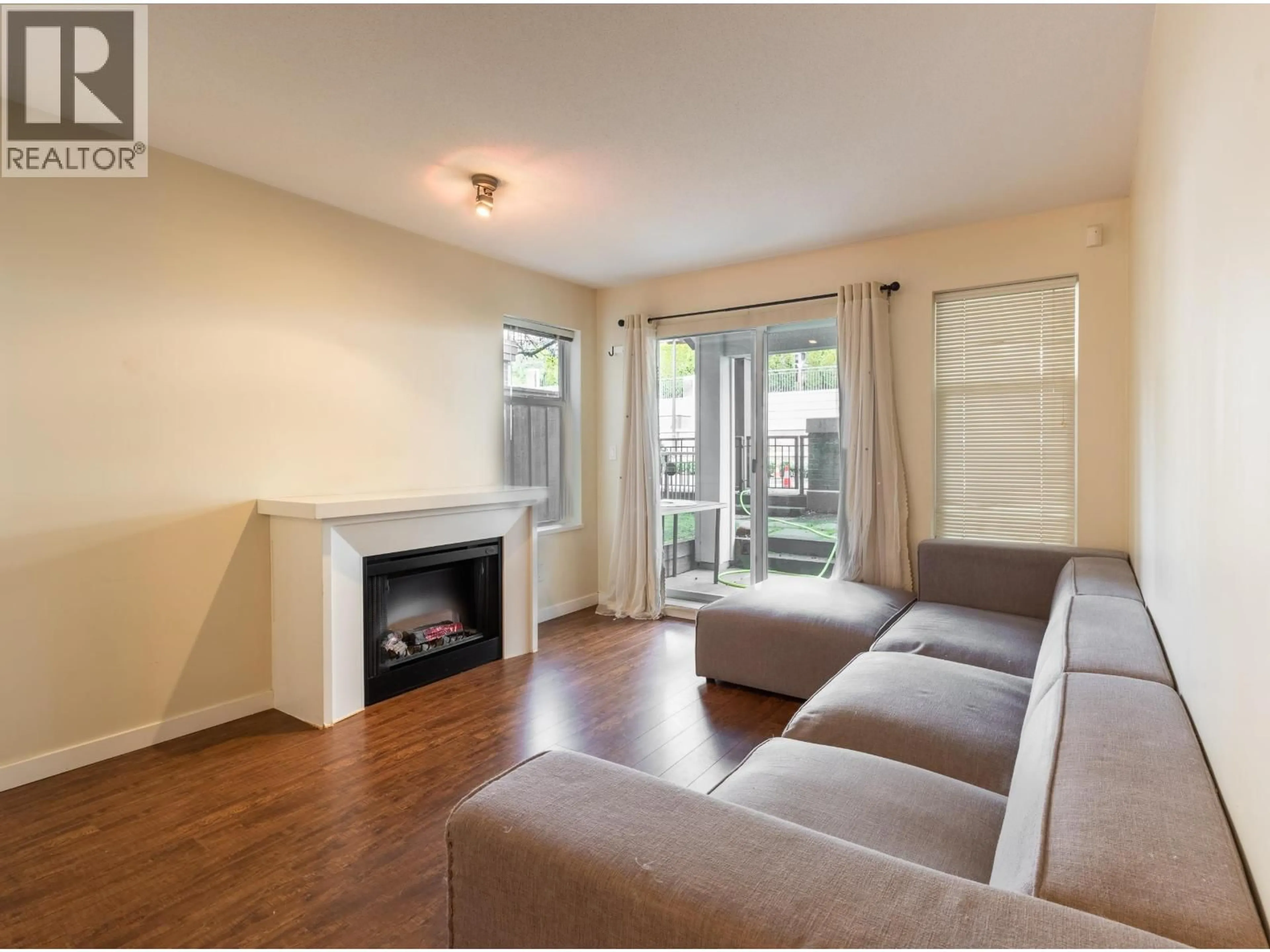Living room with furniture, wood/laminate floor for 108 - 4788 BRENTWOOD DRIVE, Burnaby British Columbia V5C0C5