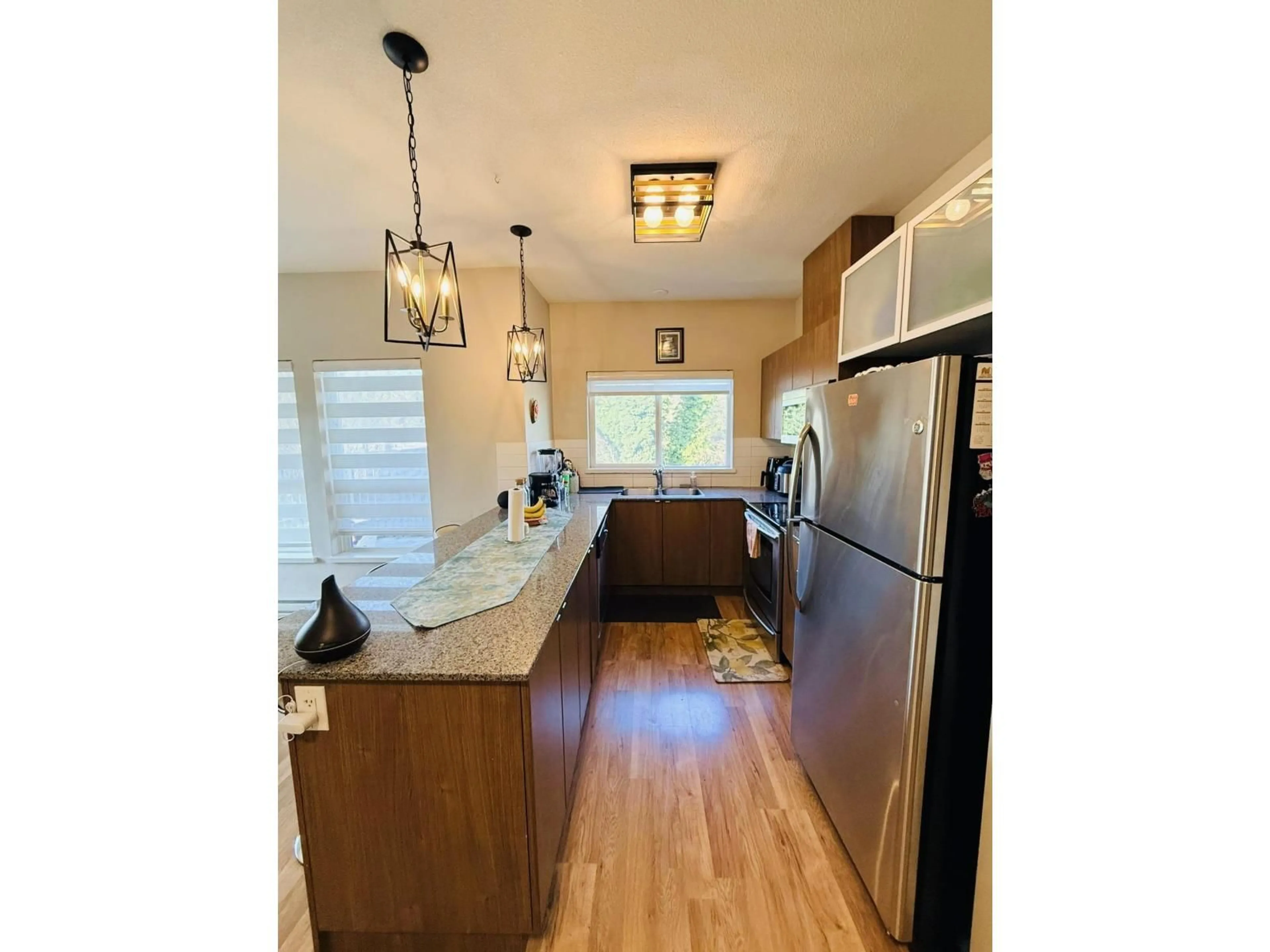 Open concept kitchen, unknown for 419 - 9655 KING GEORGE BOULEVARD, Surrey British Columbia V3T0C7