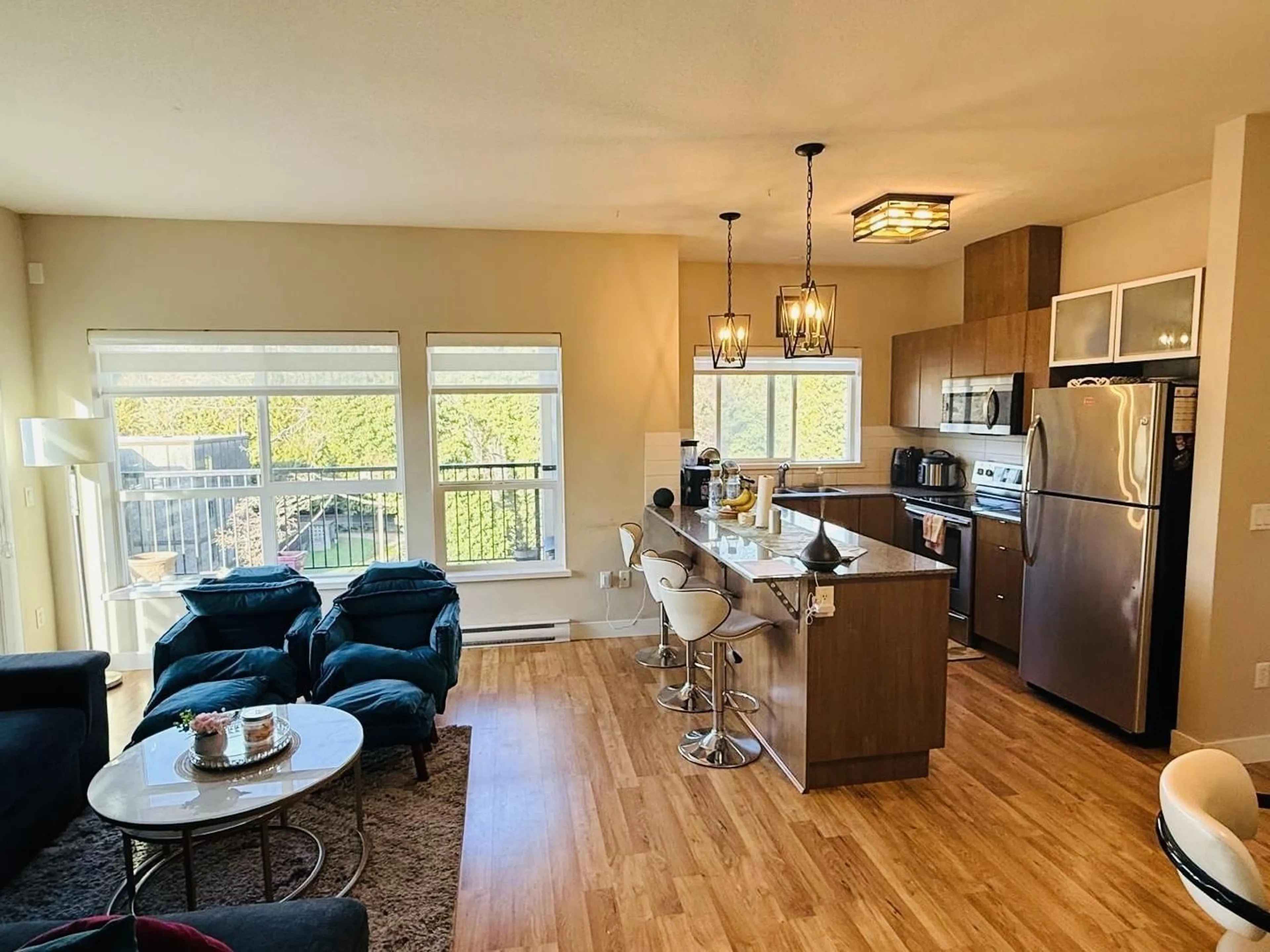 Open concept kitchen, wood/laminate floor for 419 - 9655 KING GEORGE BOULEVARD, Surrey British Columbia V3T0C7