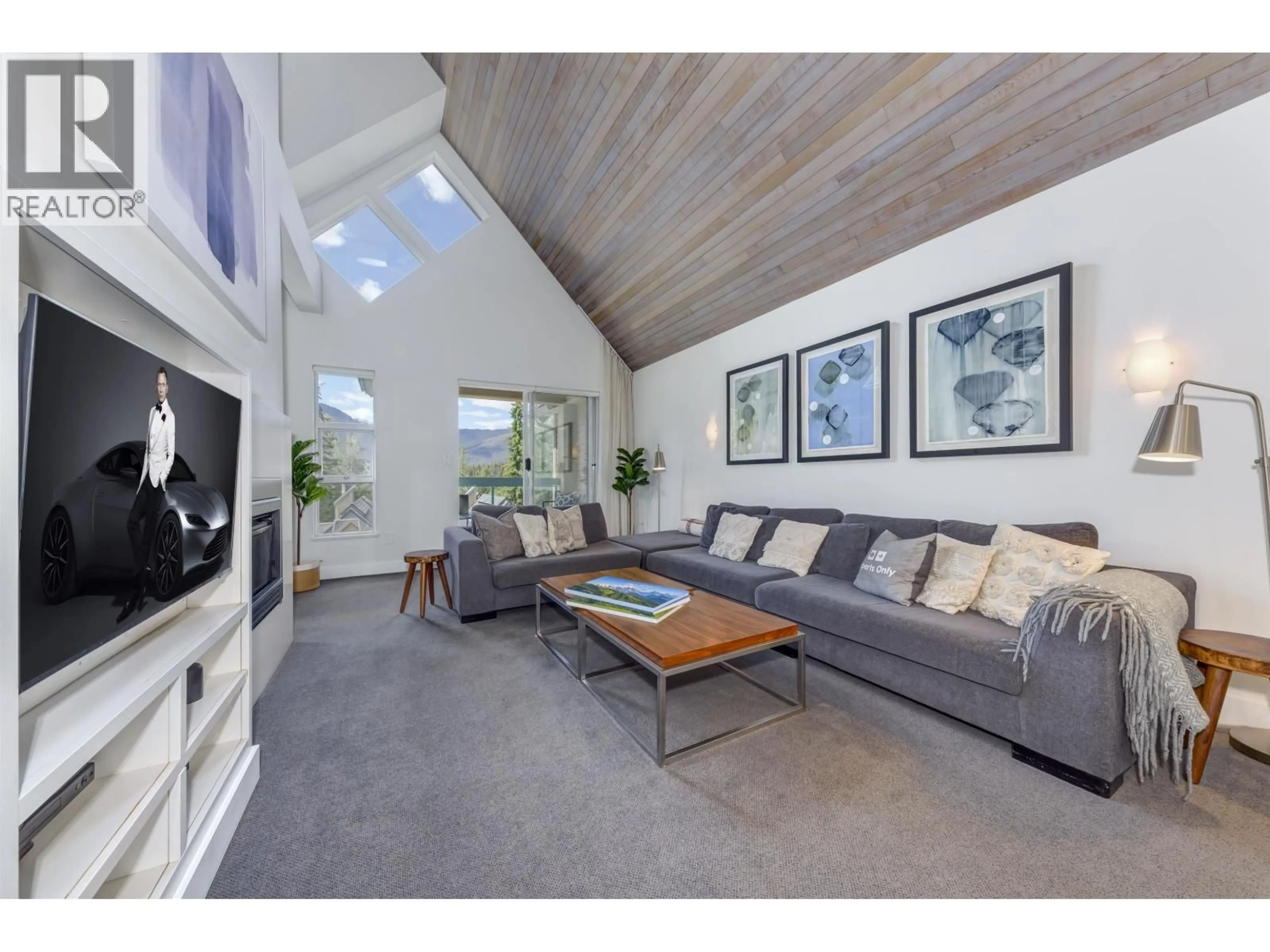 Living room with furniture, wood/laminate floor for 204 - 4865 PAINTED CLIFF ROAD, Whistler British Columbia V0N1B4
