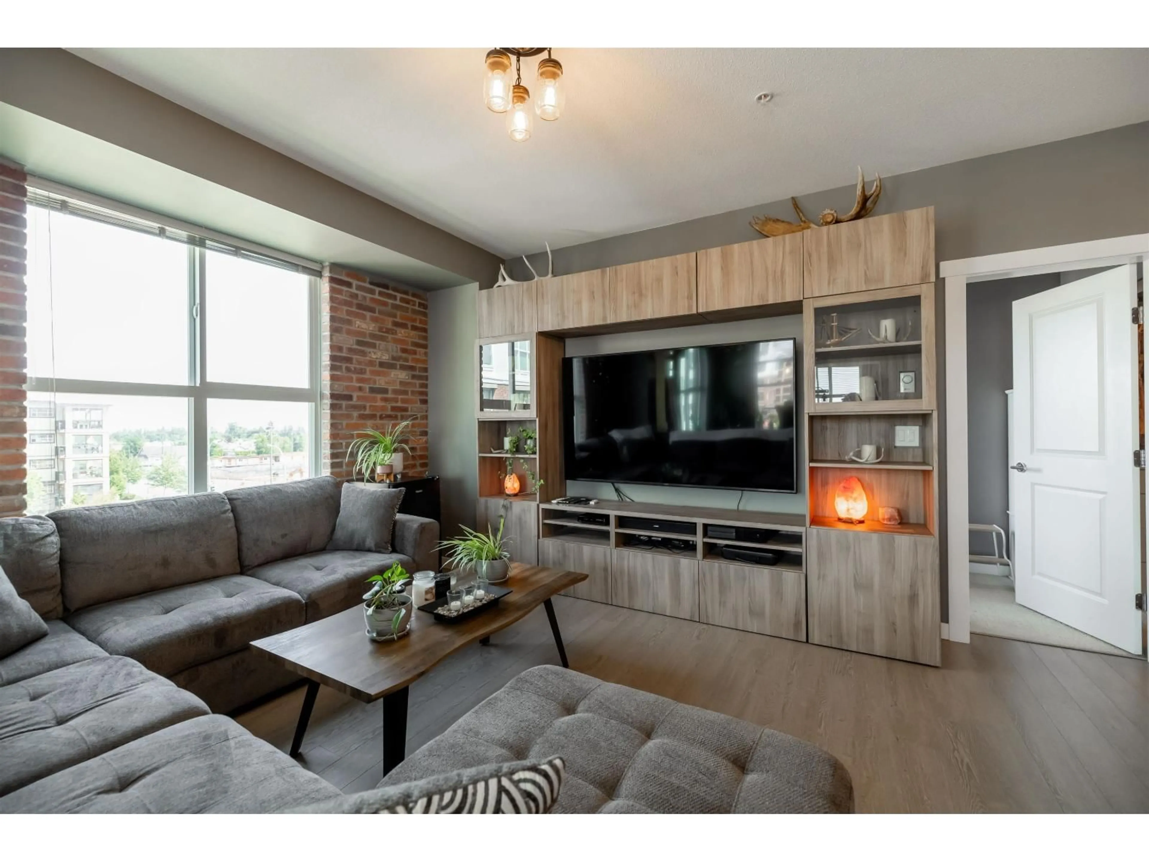 Living room with furniture, wood/laminate floor for C307 - 8150 207 STREET, Langley British Columbia V2Y4J4