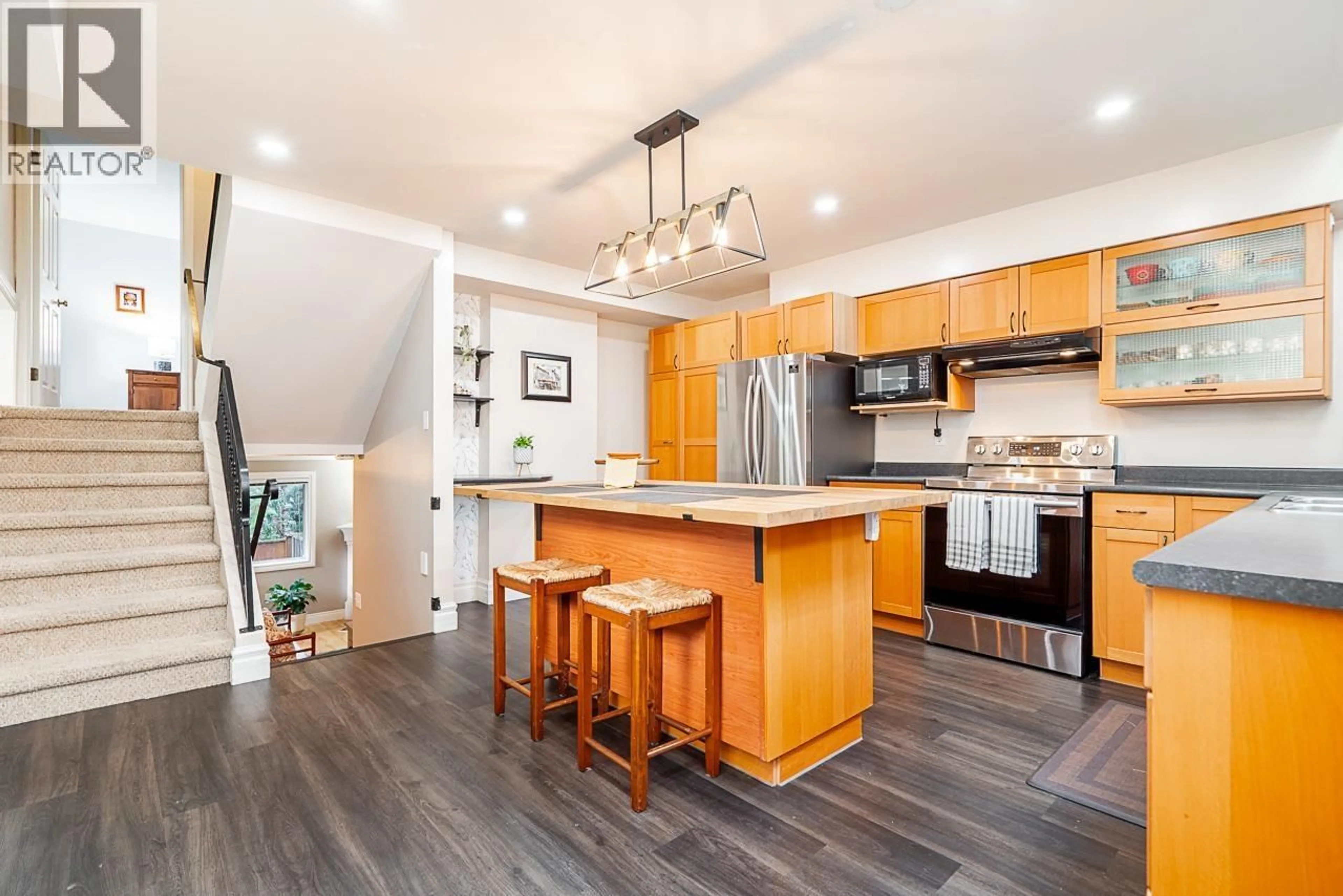 Open concept kitchen, wood/laminate floor for 4 - 3347 DEWDNEY TRUNK ROAD, Port Moody British Columbia V3H2E4