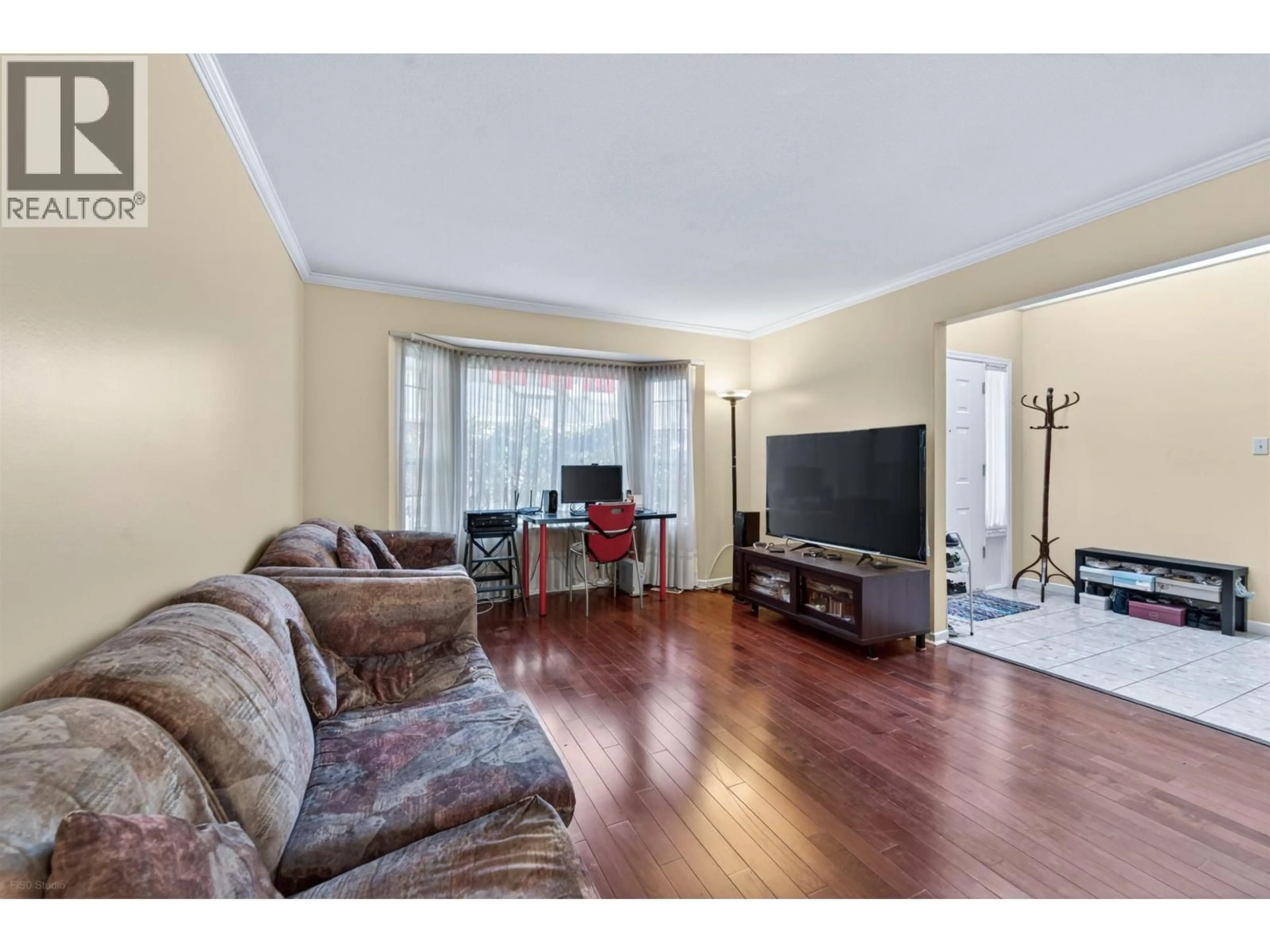 Living room with furniture, wood/laminate floor for 5 - 7531 NO. 1 ROAD, Richmond British Columbia V7C1T7