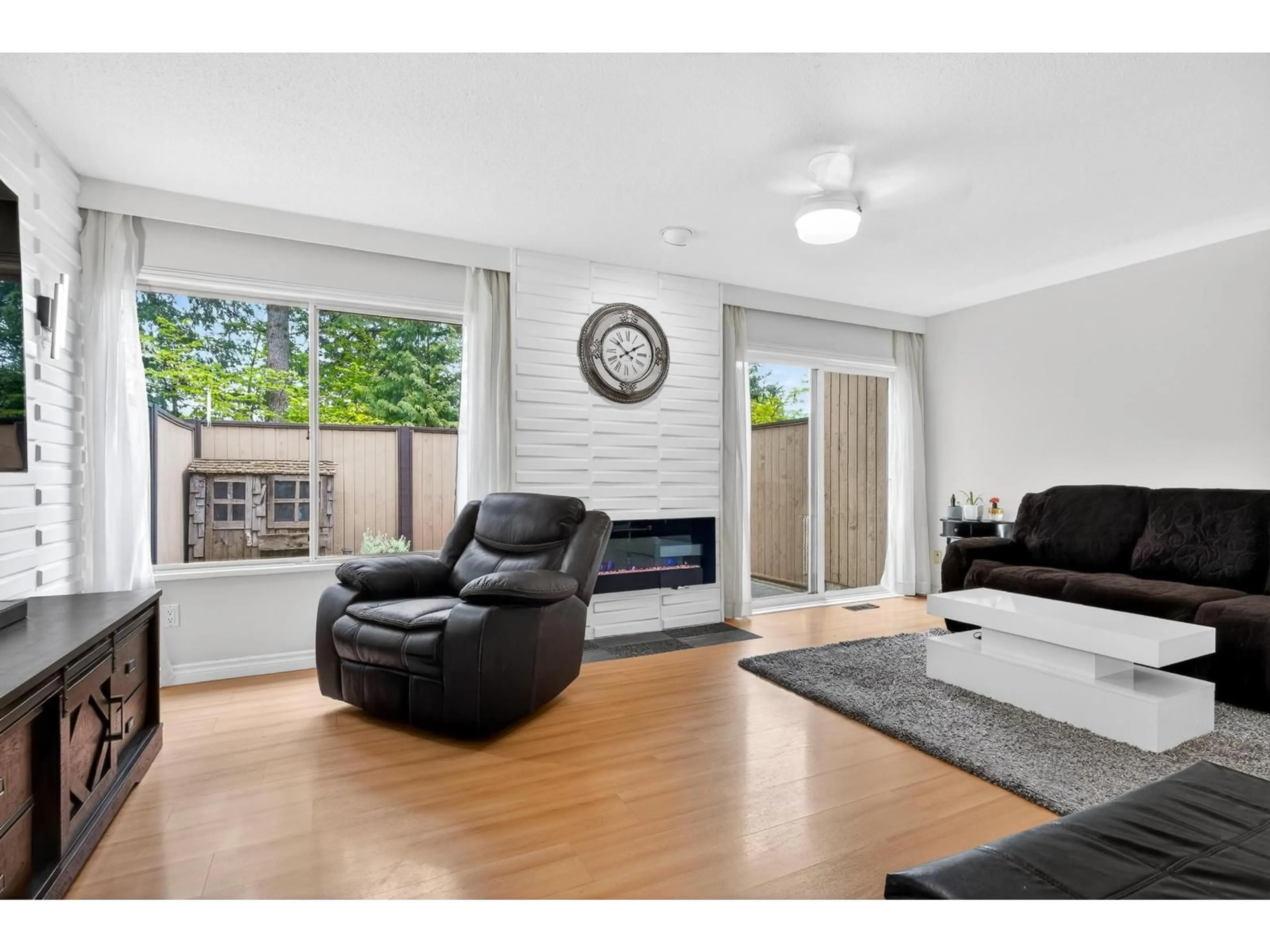 Living room with furniture, wood/laminate floor for 32 - 3015 TRETHEWEY STREET, Abbotsford British Columbia V2T3R4