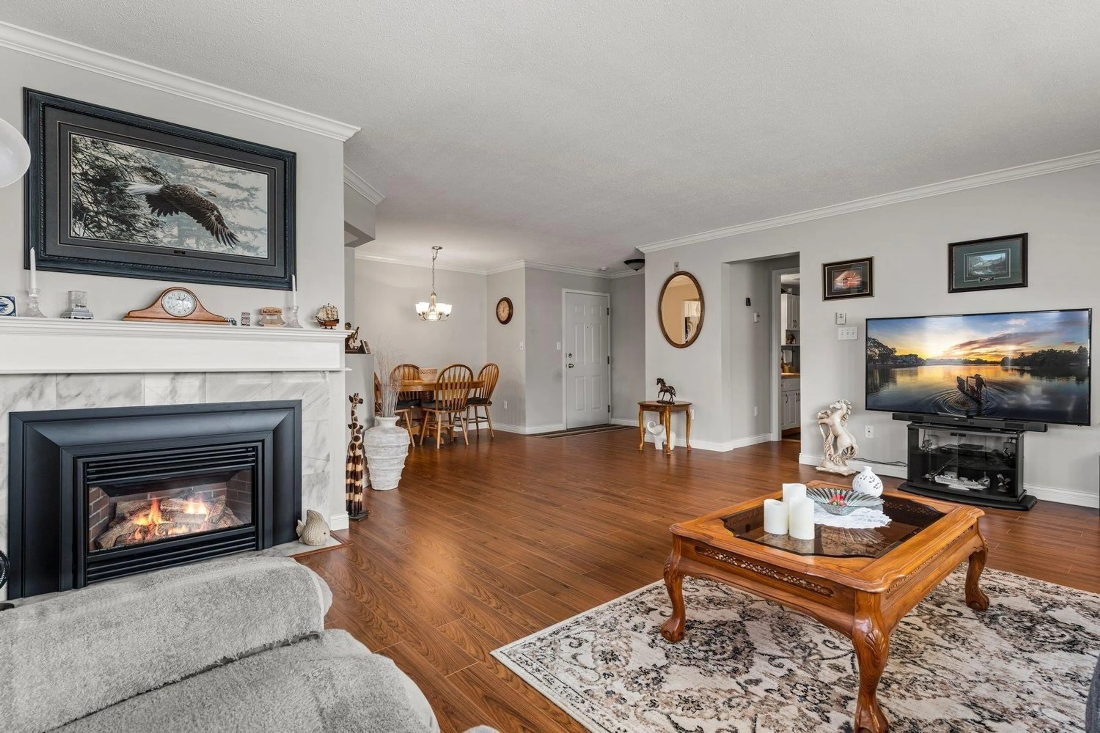 Living room with furniture, wood/laminate floor for 209 - 7651 AMBER DRIVE, Chilliwack British Columbia V2R3J6