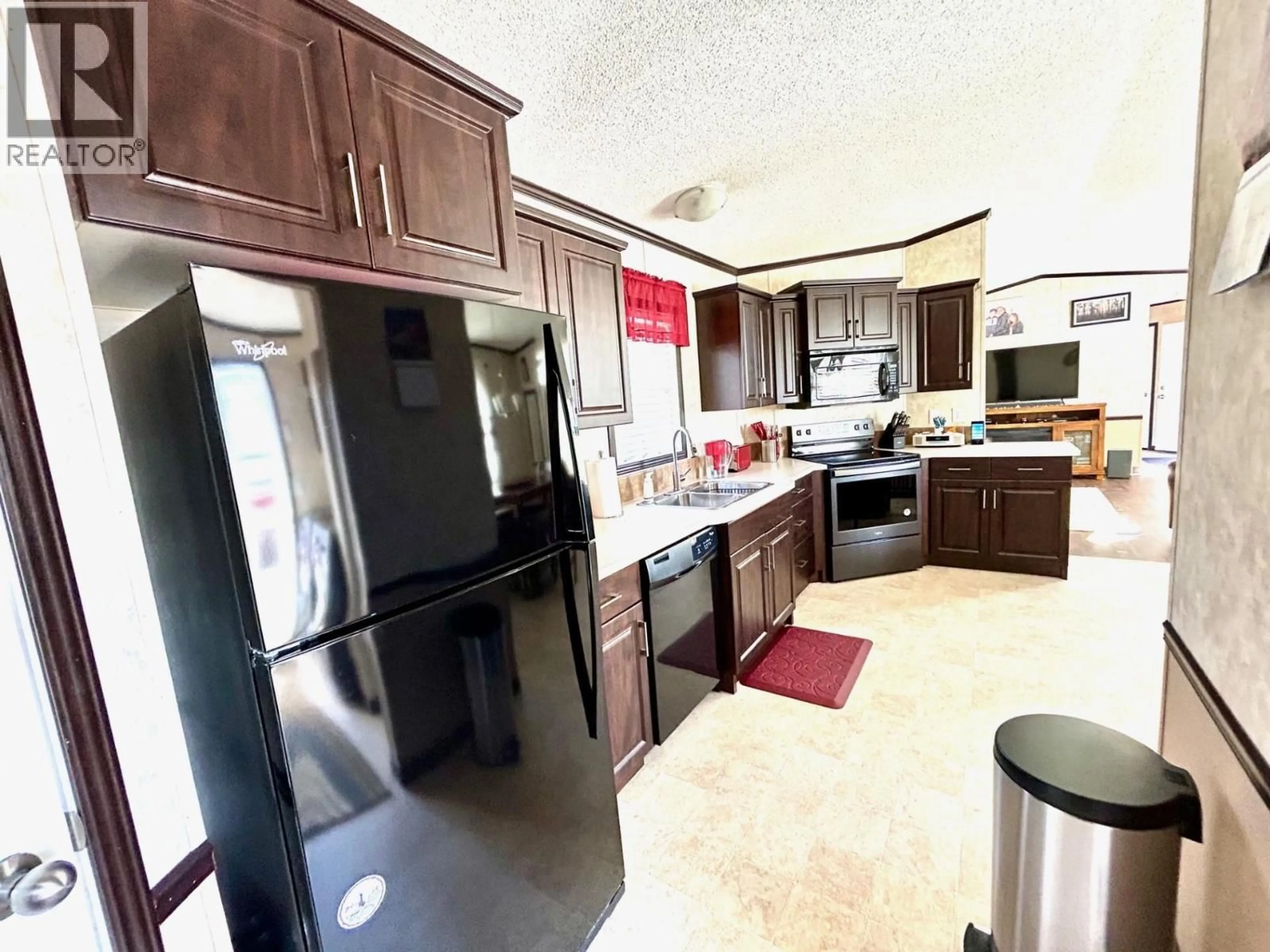 Open concept kitchen, ceramic/tile floor for 5227 42 STREET, Fort Nelson British Columbia V0C1R0