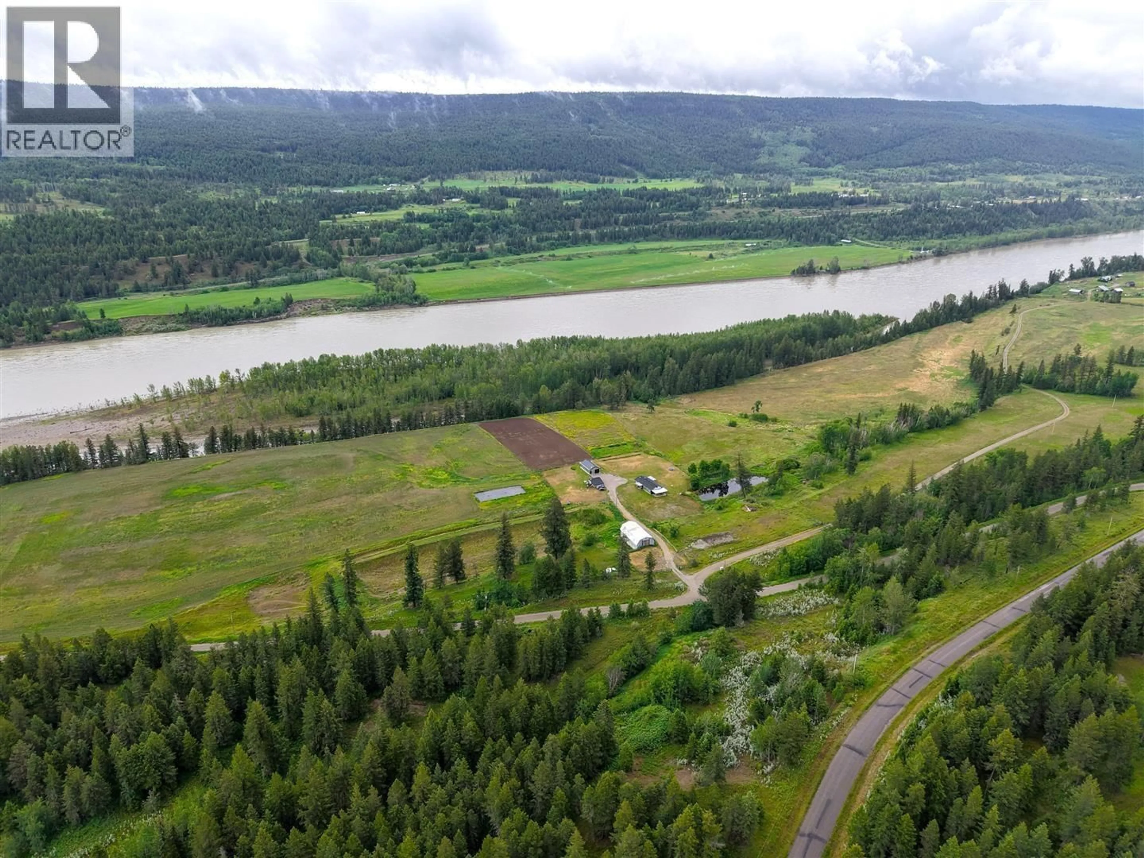 A pic from outside/outdoor area/front of a property/back of a property/a pic from drone, water/lake/river/ocean view for 9811 MARGUERITE FERRY ROAD, Quesnel British Columbia V2J6R6