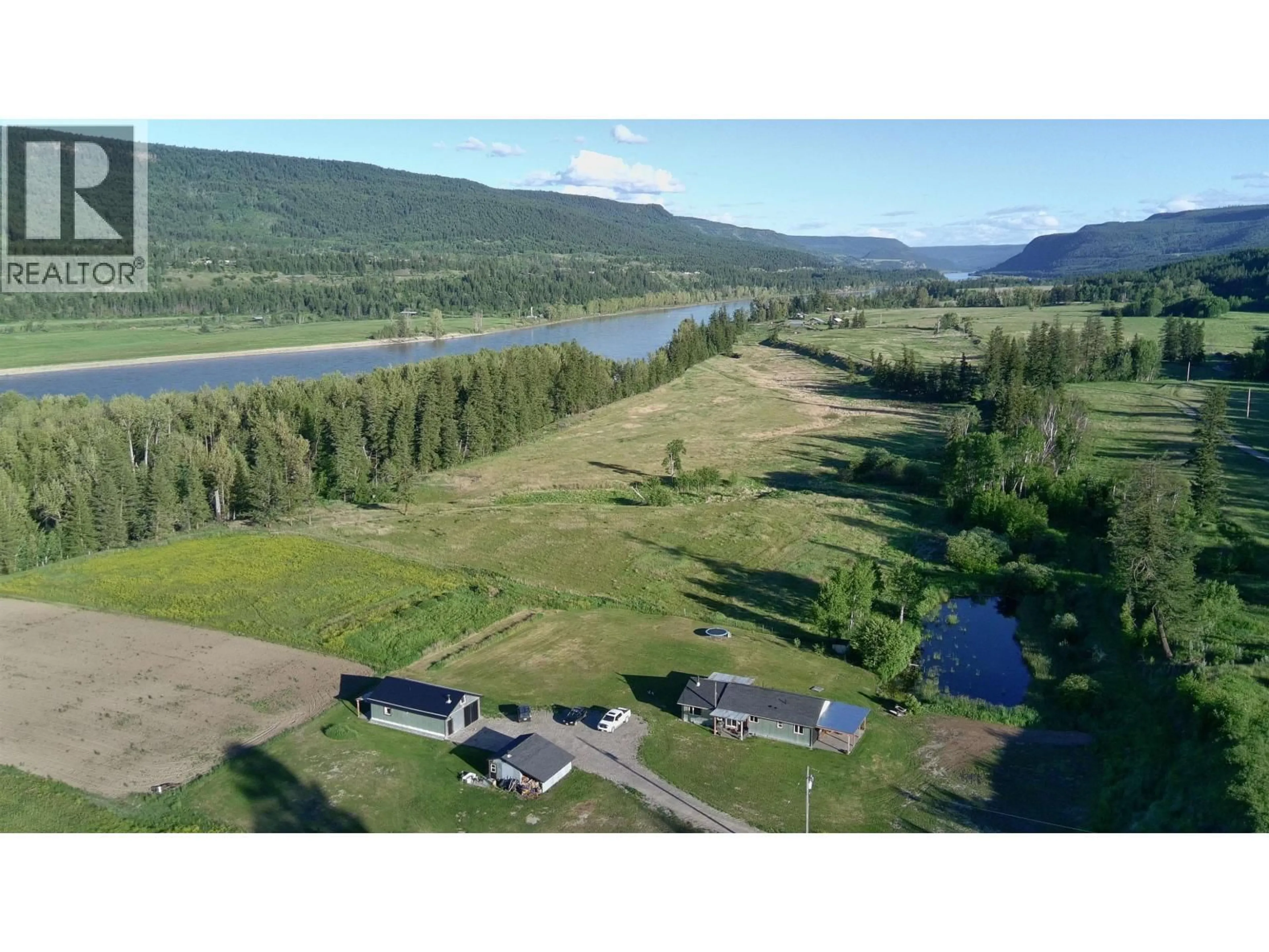 A pic from outside/outdoor area/front of a property/back of a property/a pic from drone, water/lake/river/ocean view for 9811 MARGUERITE FERRY ROAD, Quesnel British Columbia V2J6R6