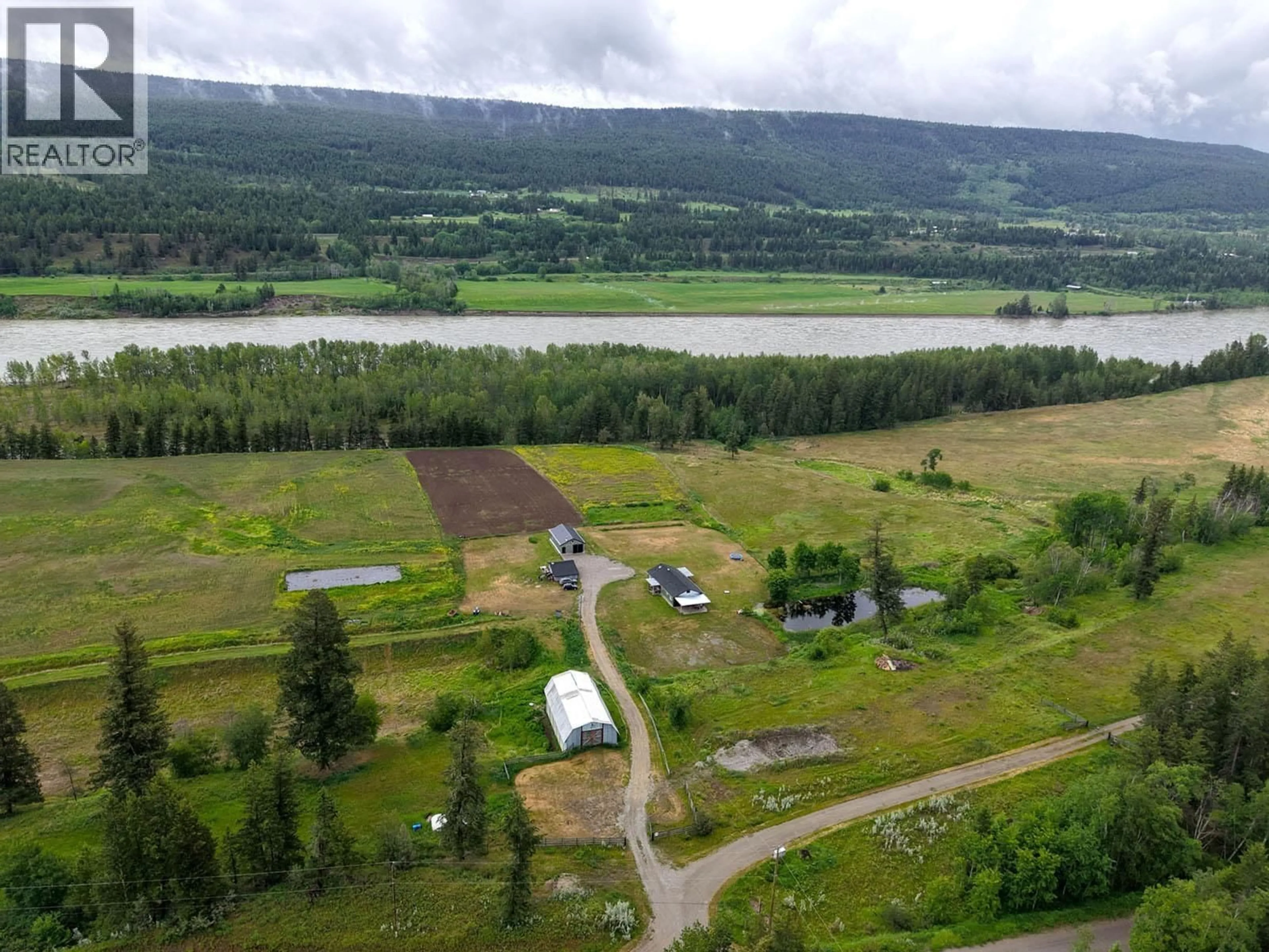 A pic from outside/outdoor area/front of a property/back of a property/a pic from drone, water/lake/river/ocean view for 9811 MARGUERITE FERRY ROAD, Quesnel British Columbia V2J6R6