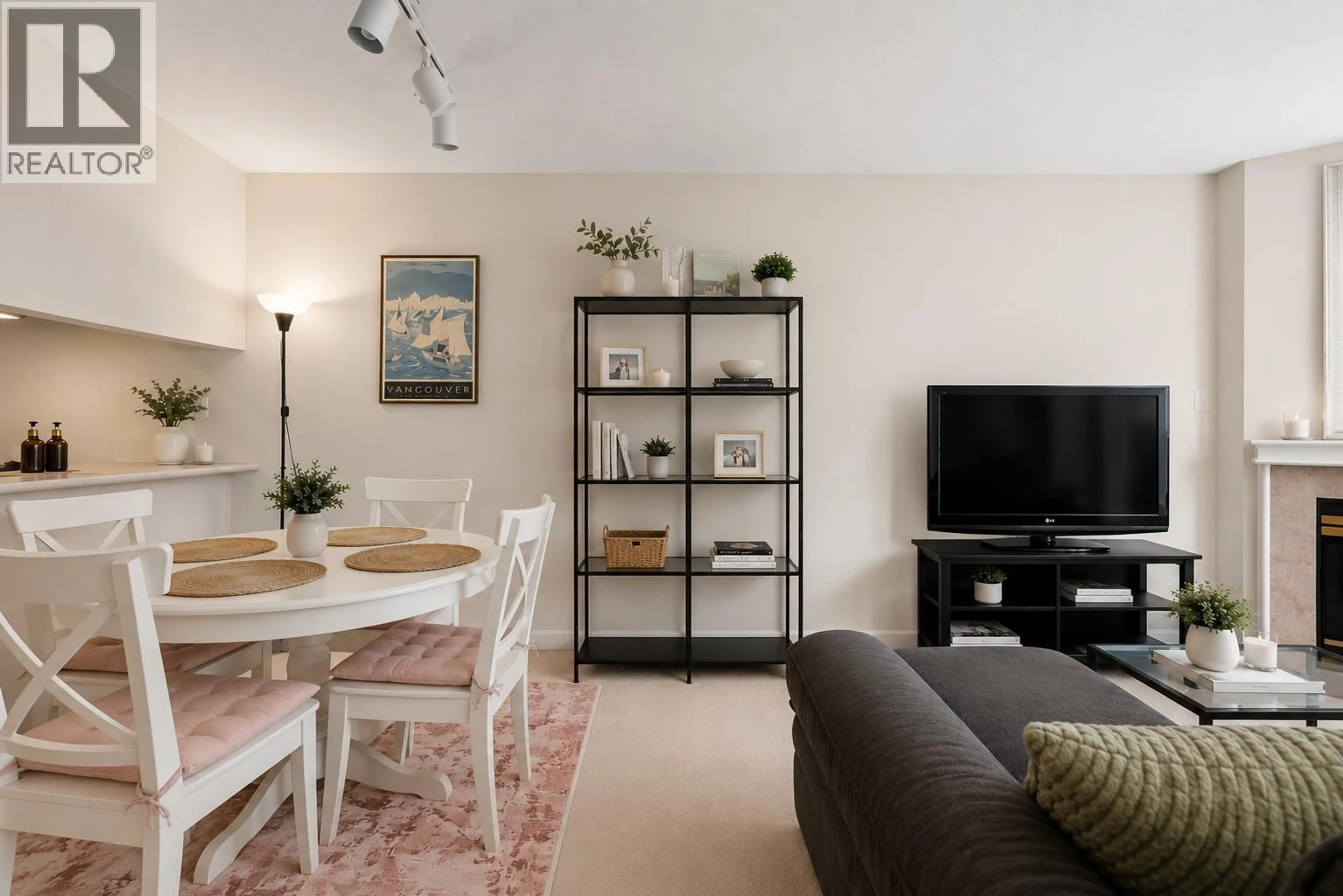 Living room with furniture, wood/laminate floor for 108 - 3250 BROADWAY, Vancouver British Columbia V6K2H4