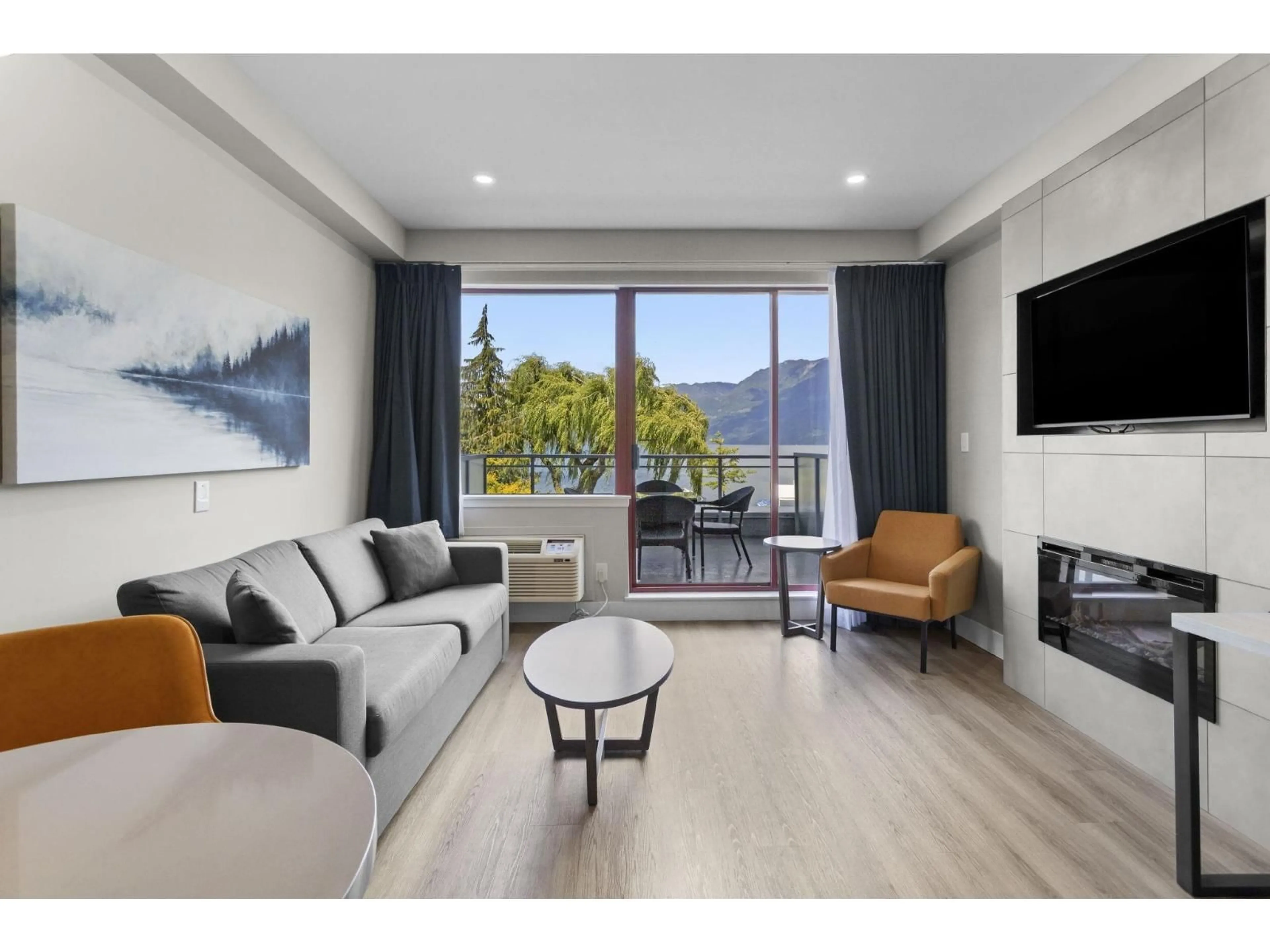 Living room with furniture, wood/laminate floor for 206C - 160 ESPLANADE AVENUE, Harrison Hot Springs British Columbia V0M1K0
