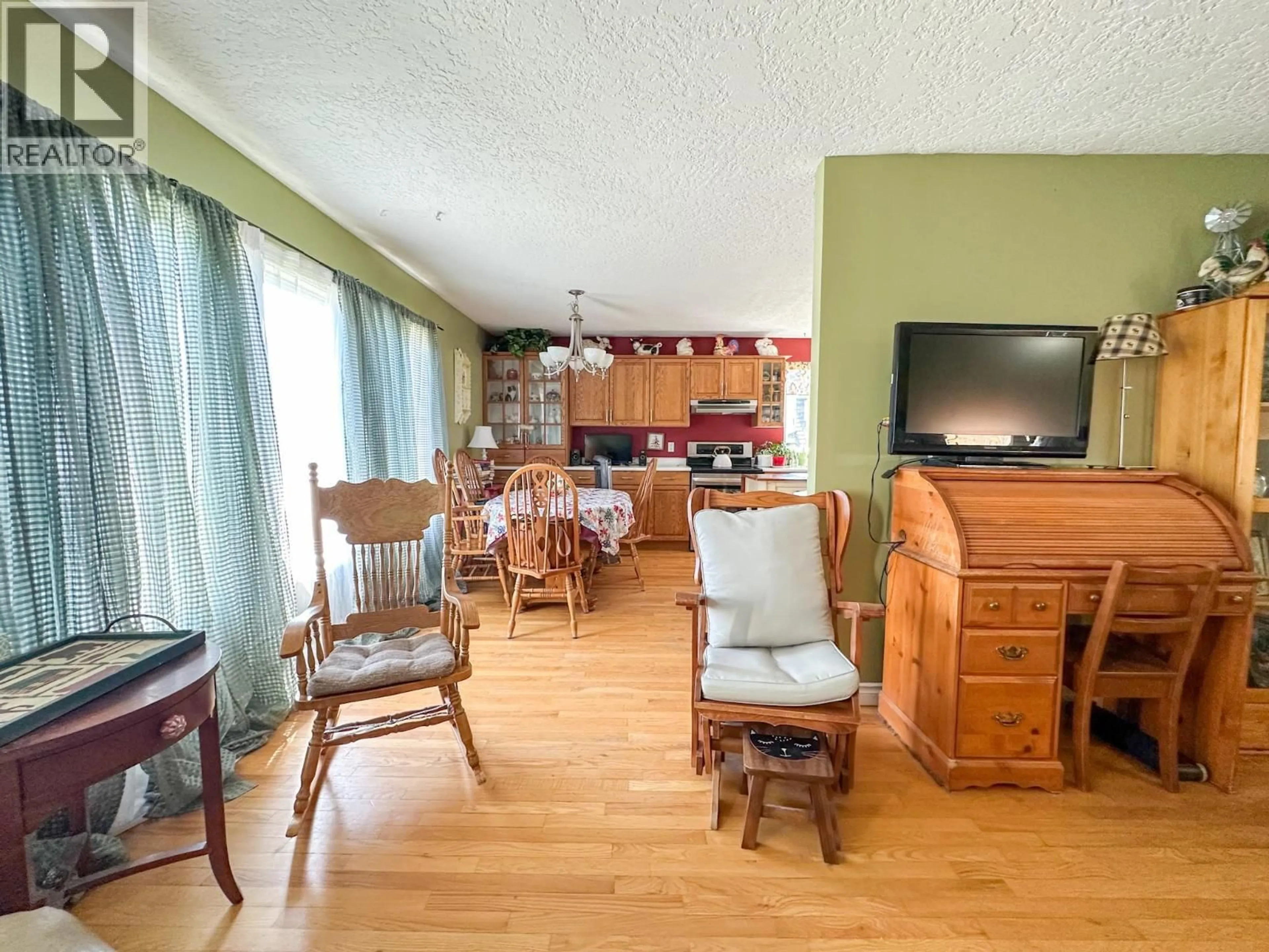 Living room with furniture, wood/laminate floor for 19 INGENIKA DRIVE, Mackenzie British Columbia V0J2C0
