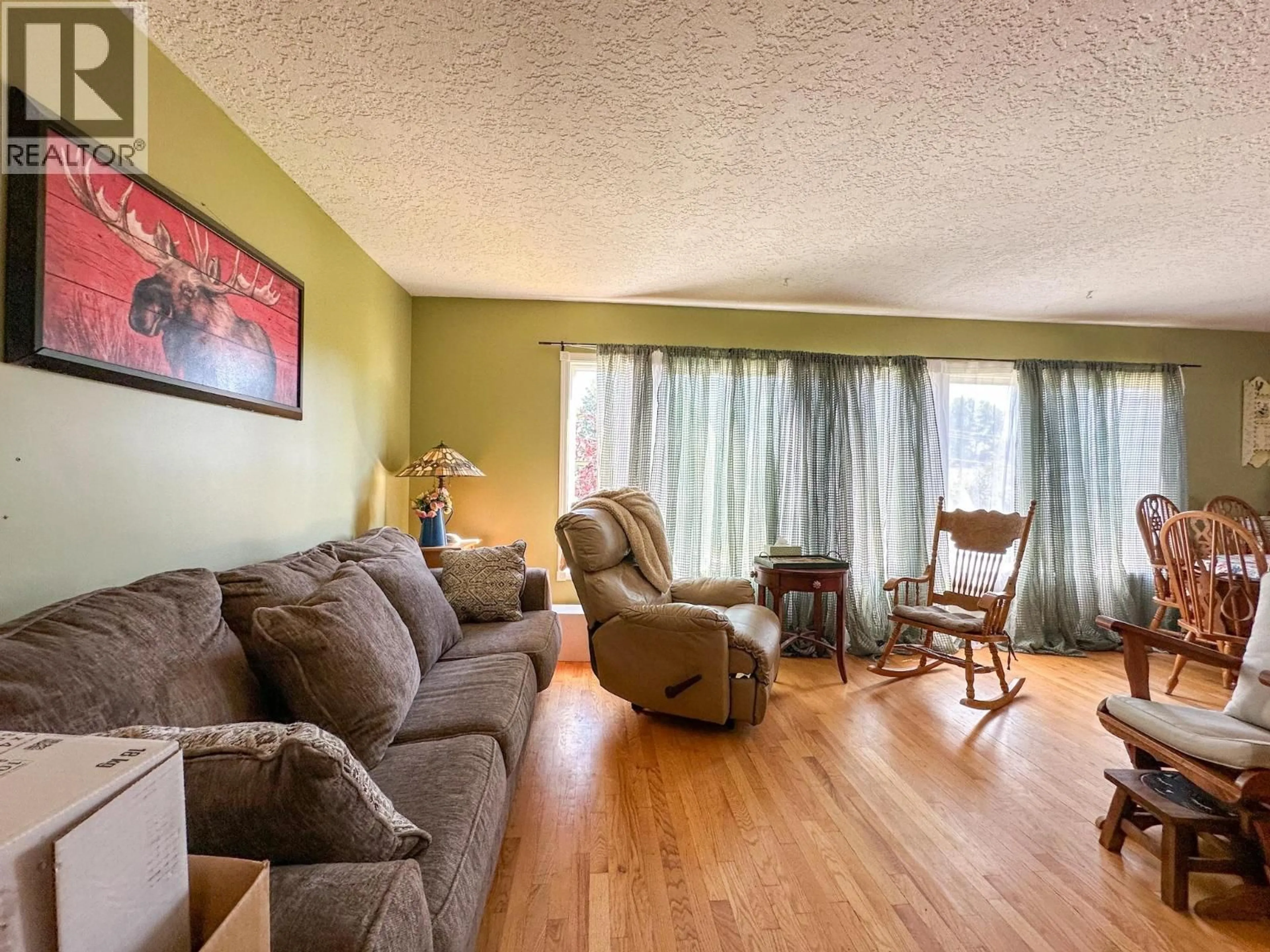 Living room with furniture, wood/laminate floor for 19 INGENIKA DRIVE, Mackenzie British Columbia V0J2C0