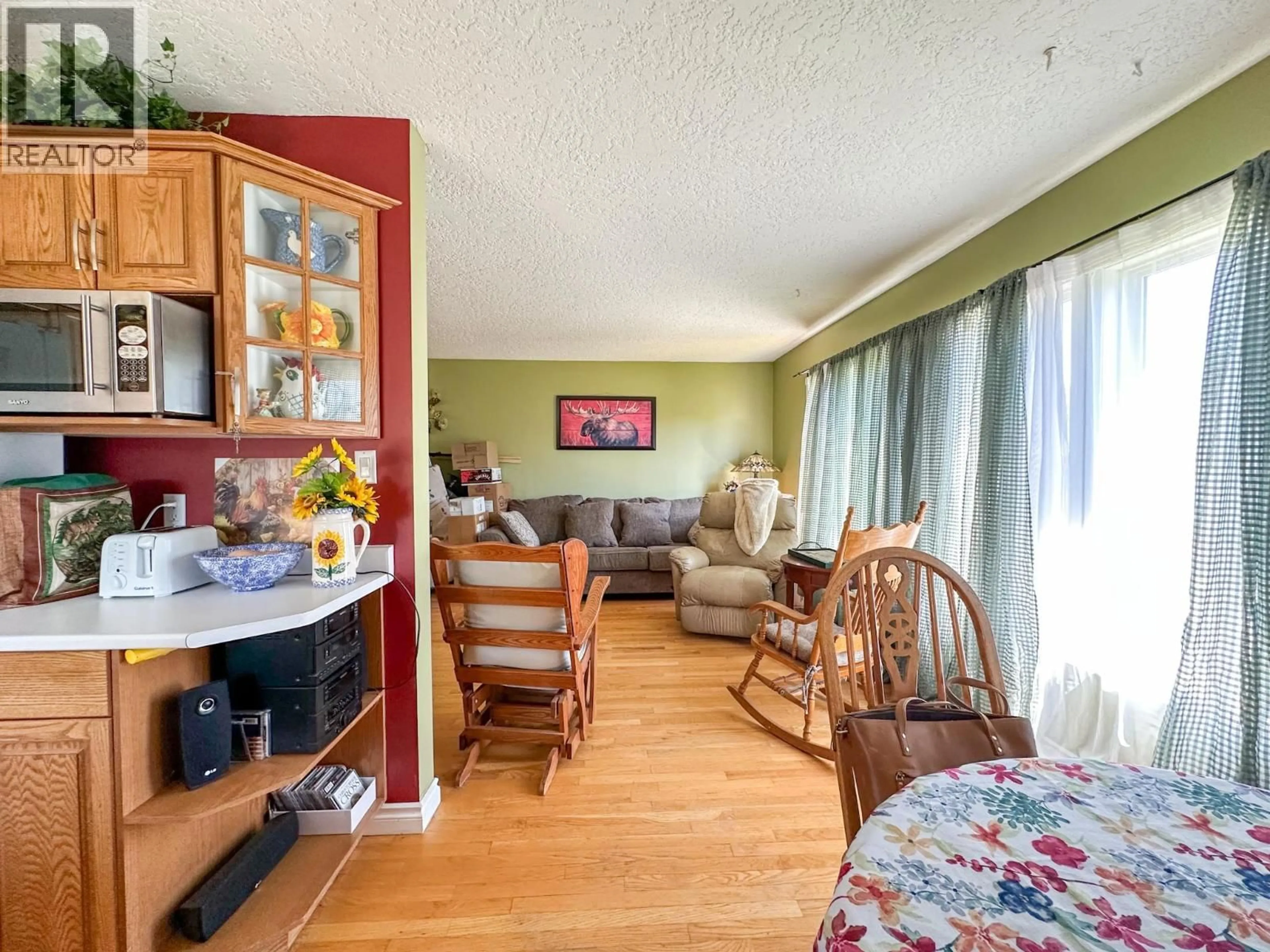 Living room with furniture, wood/laminate floor for 19 INGENIKA DRIVE, Mackenzie British Columbia V0J2C0
