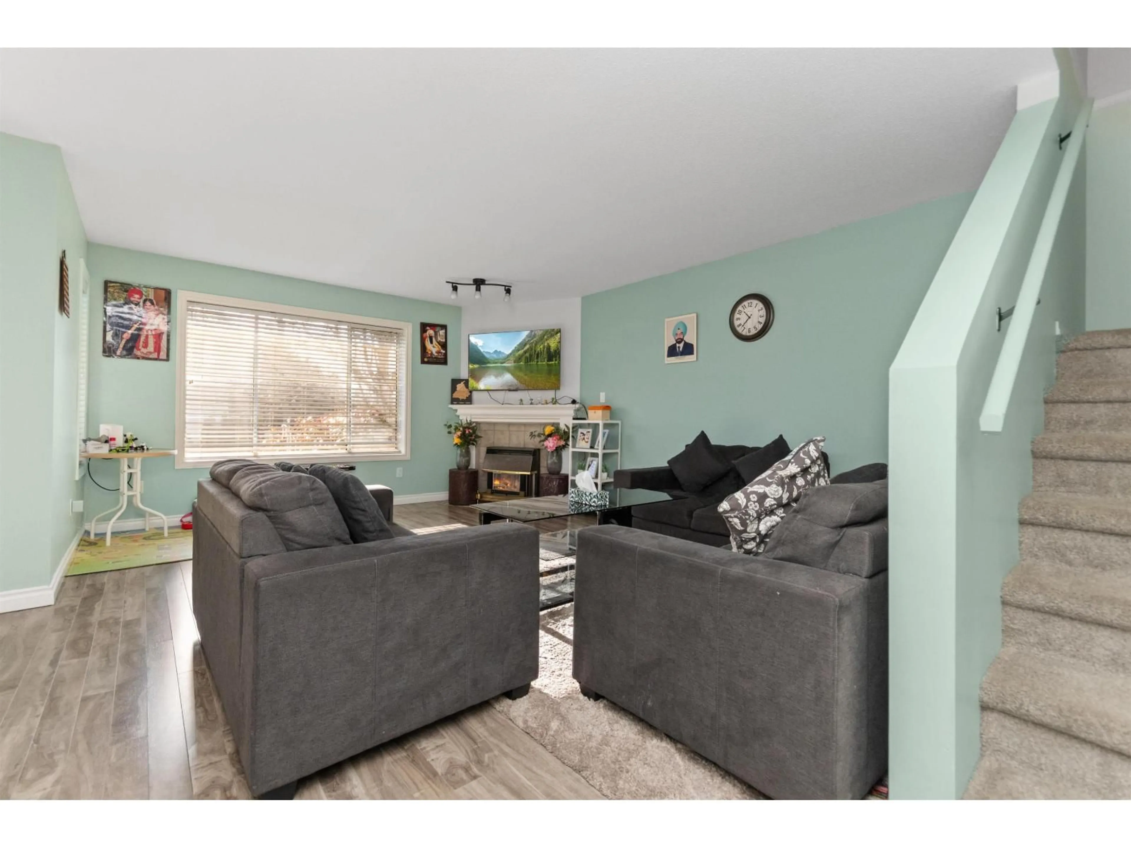 Living room with furniture, wood/laminate floor for 12 - 2575 MCADAM STREET, Abbotsford British Columbia V2S7G4