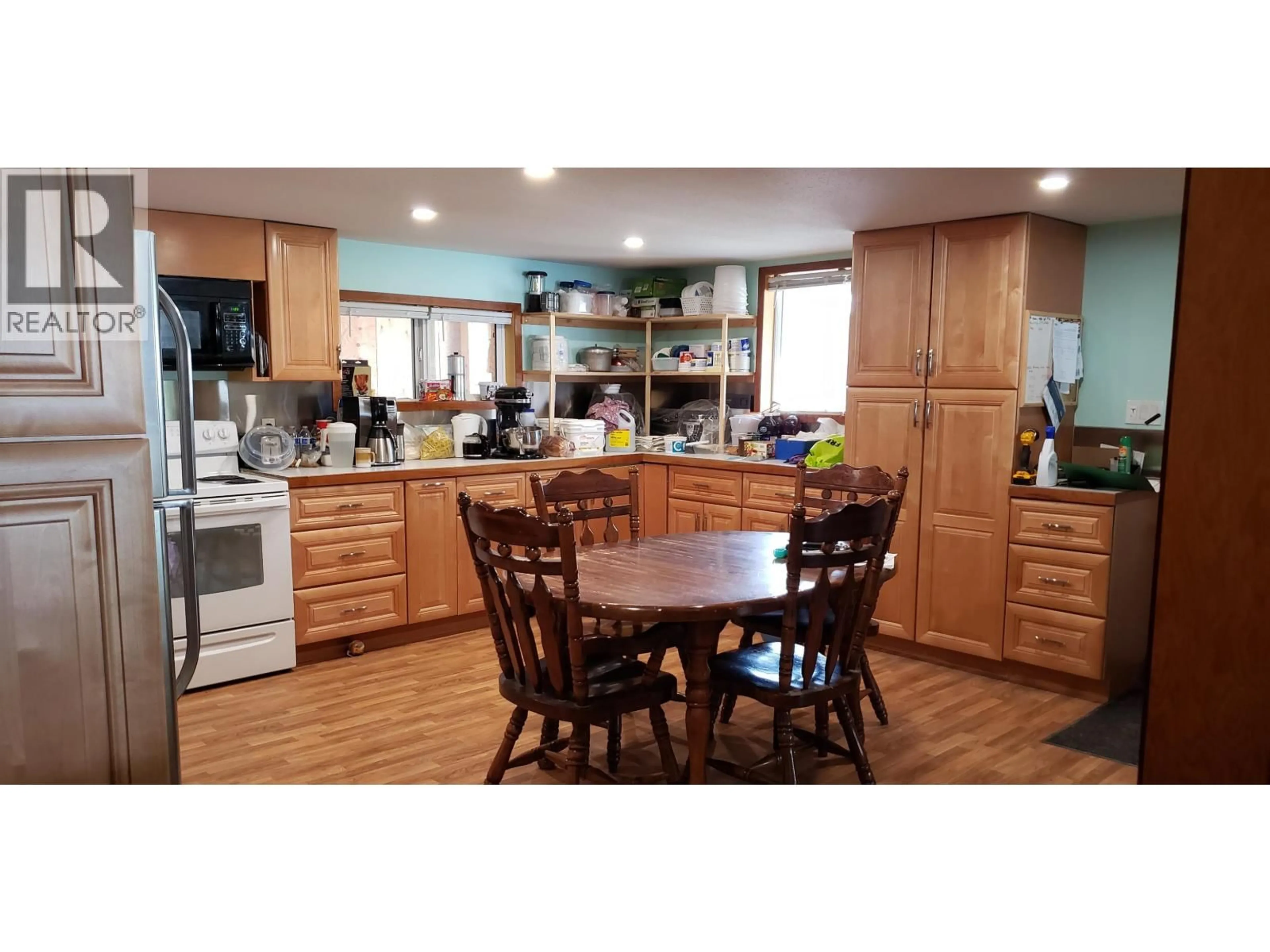 Open concept kitchen, wood/laminate floor for 3724 BOWERS LAKE ROAD, Canim Lake British Columbia V0K1X3