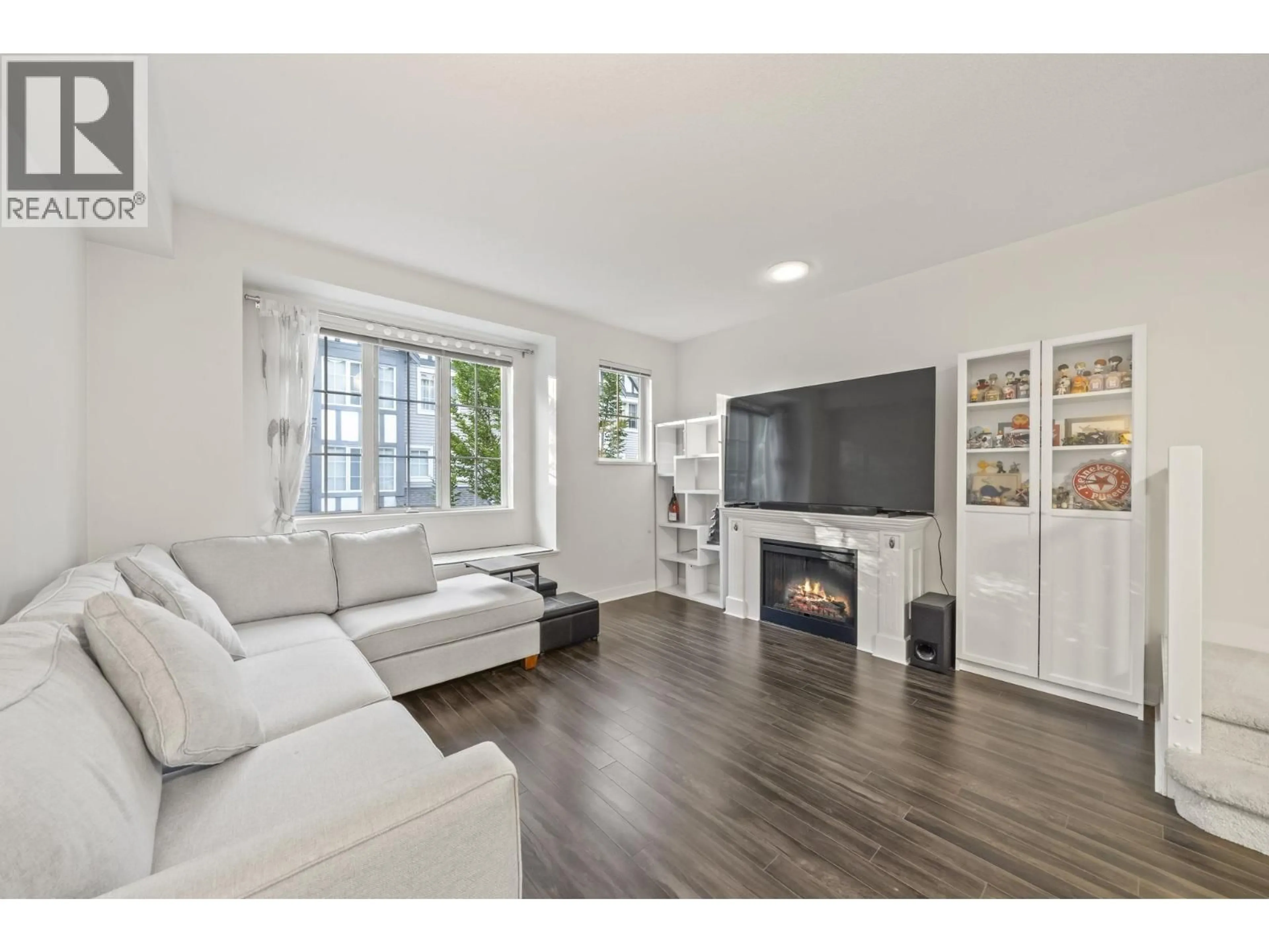 Living room with furniture, wood/laminate floor for 30 - 8533 CUMBERLAND PLACE, Burnaby British Columbia V3N5C1