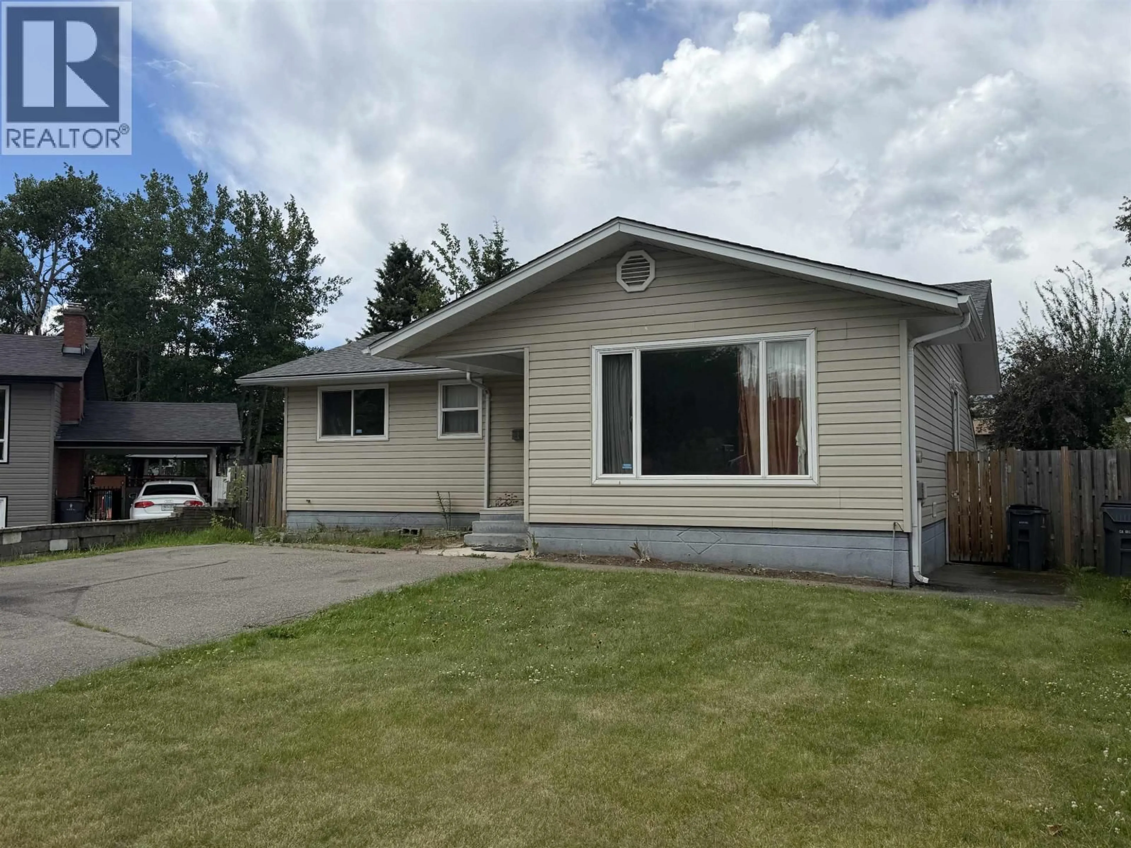 Home with vinyl exterior material, street for 1755 IRWIN STREET, Prince George British Columbia V2M2Y6