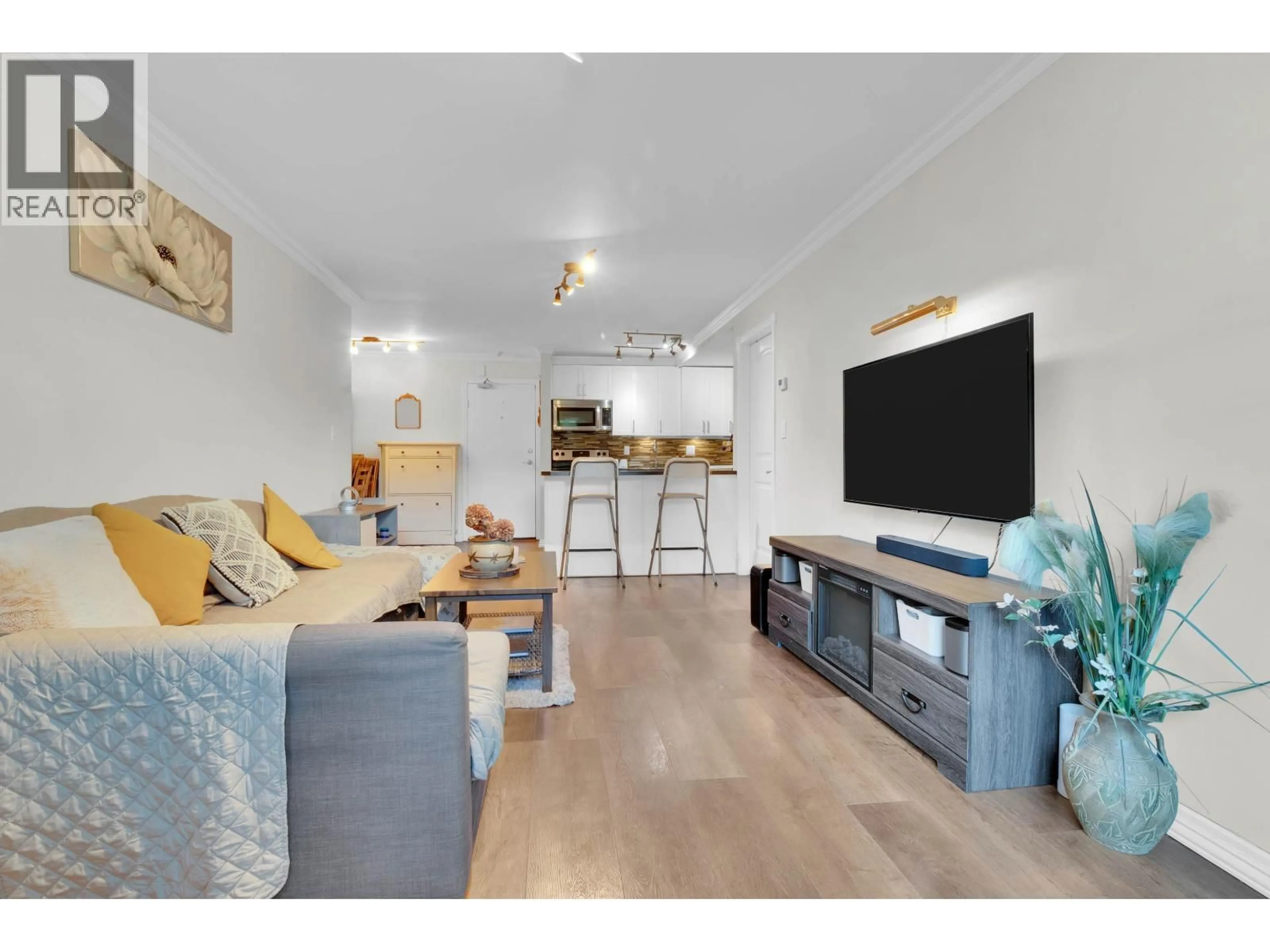 Living room with furniture, wood/laminate floor for 106 - 1122 KING ALBERT AVENUE, Coquitlam British Columbia V3J1X7