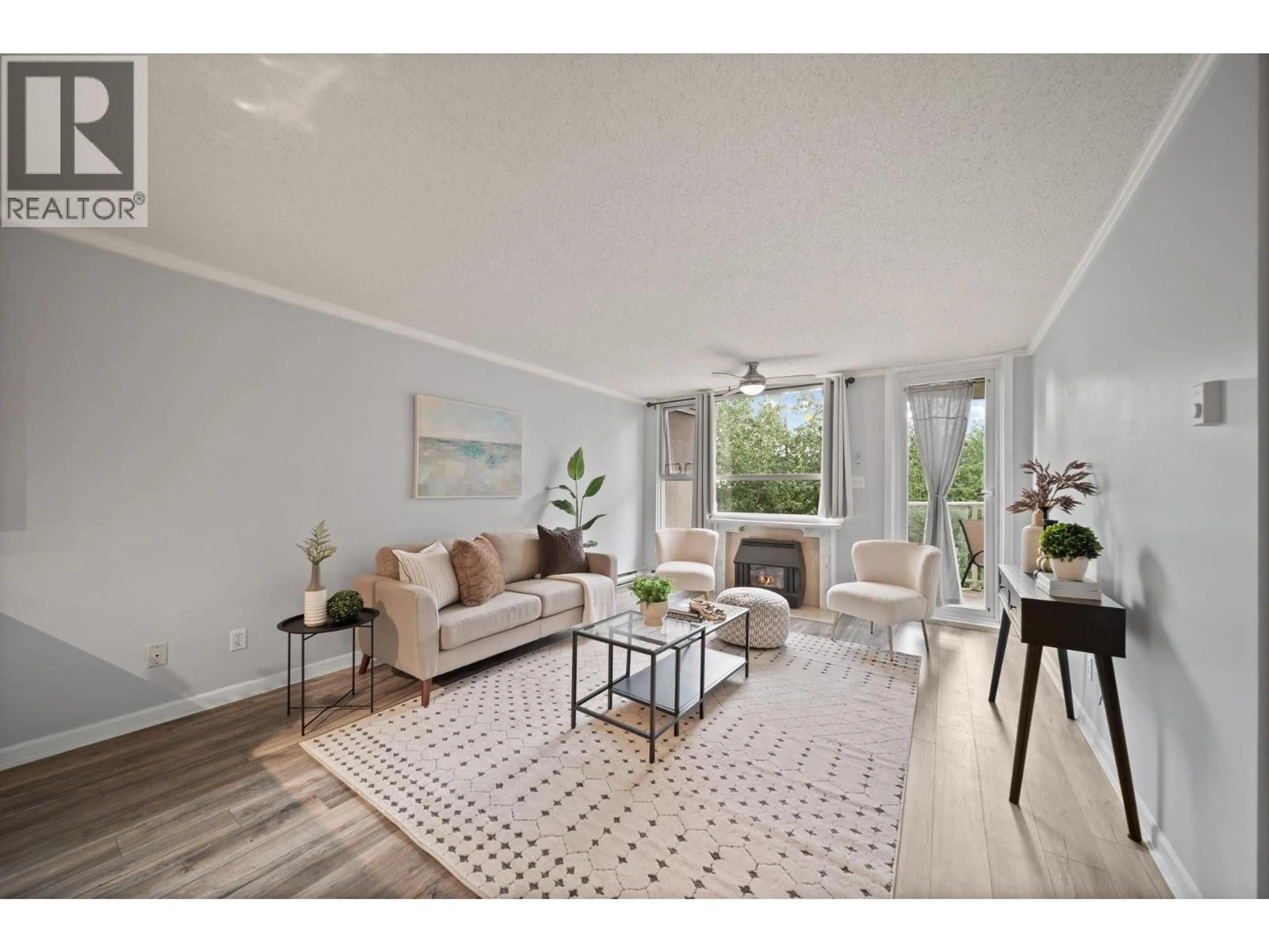 Living room with furniture, wood/laminate floor for 305 - 1250 QUAYSIDE DRIVE, New Westminster British Columbia V3M6E2