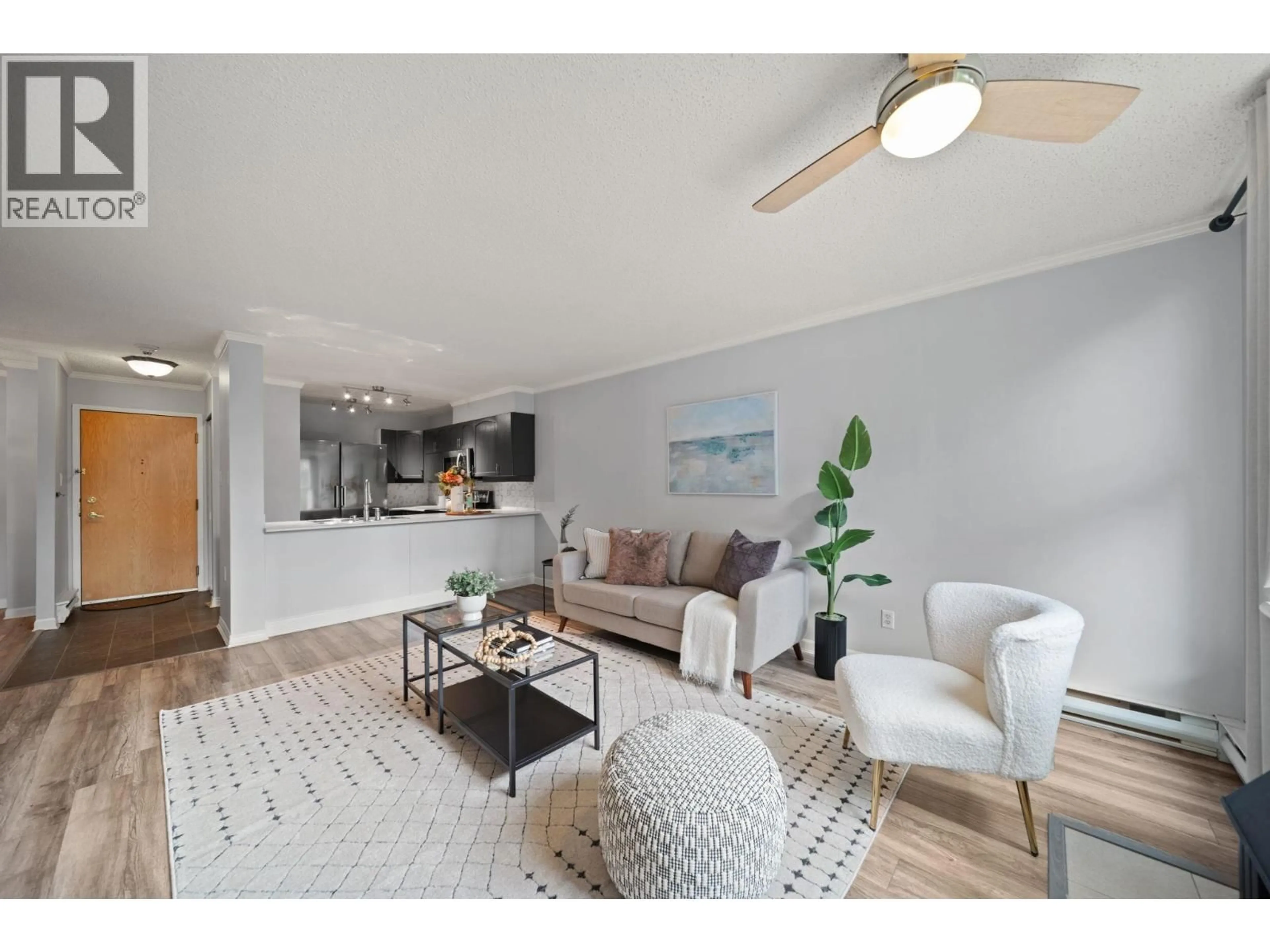 Living room with furniture, wood/laminate floor for 305 - 1250 QUAYSIDE DRIVE, New Westminster British Columbia V3M6E2