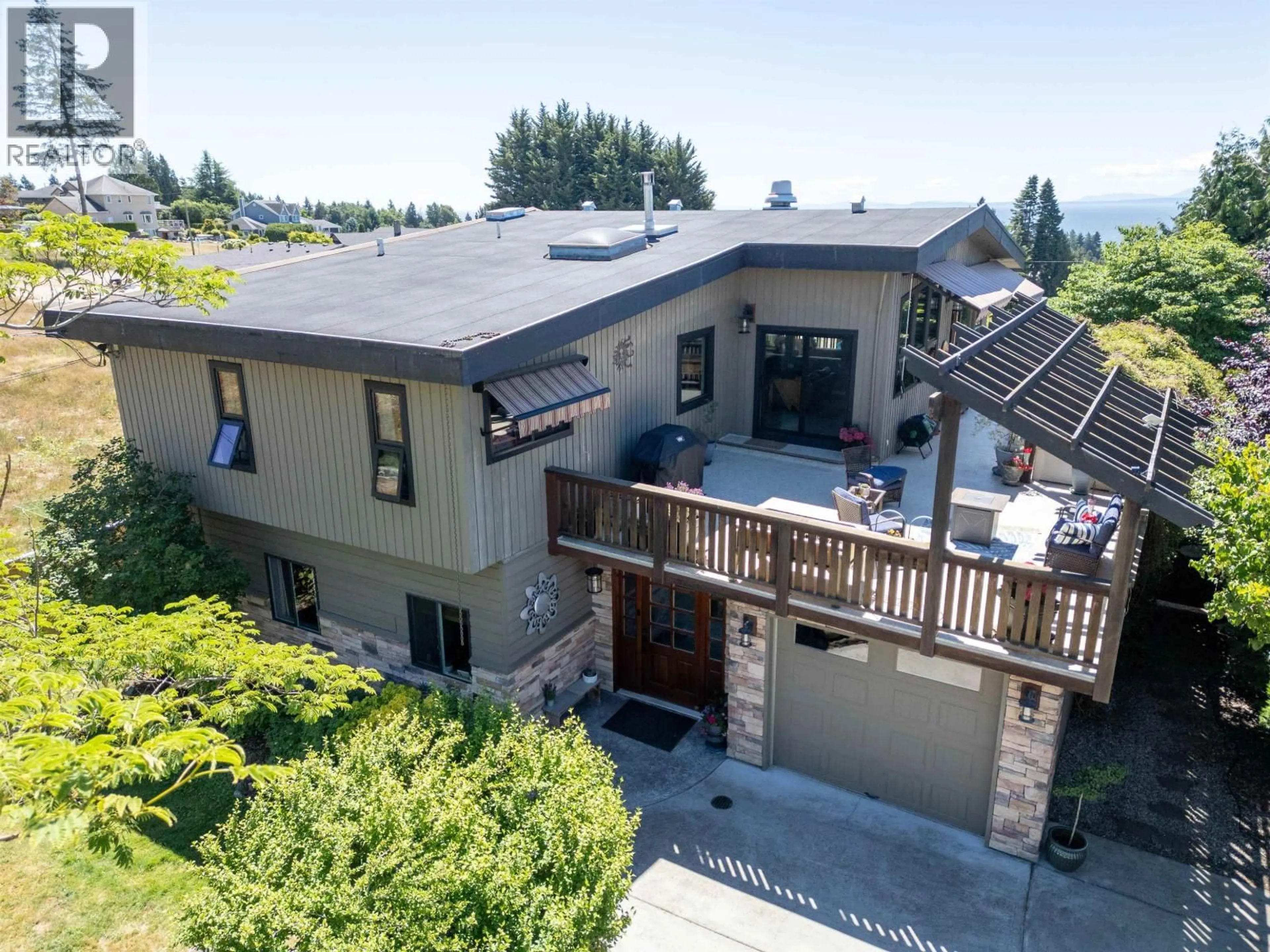 A pic from outside/outdoor area/front of a property/back of a property/a pic from drone, mountain view for 5125 SALAL ROAD, Sechelt British Columbia V7Z0B7