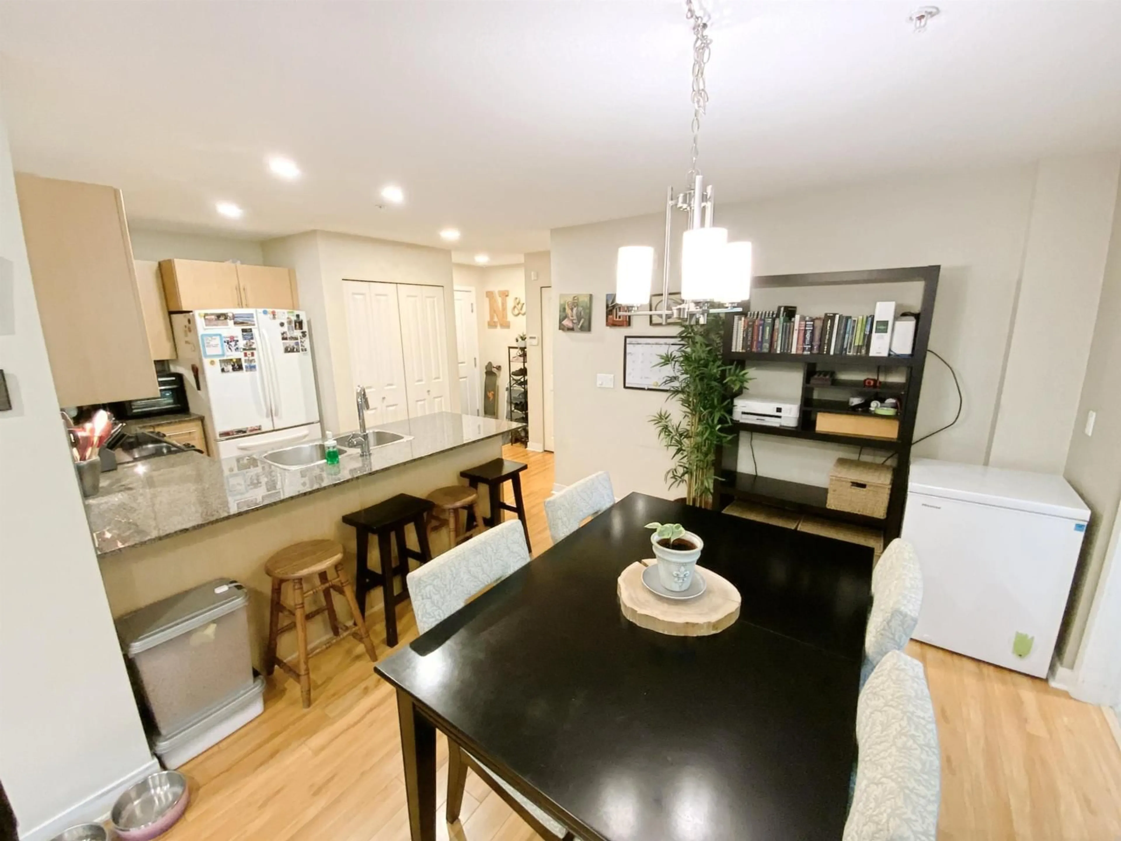 Open concept kitchen, wood/laminate floor for A106 - 8929 202 STREET, Langley British Columbia V1M0B4