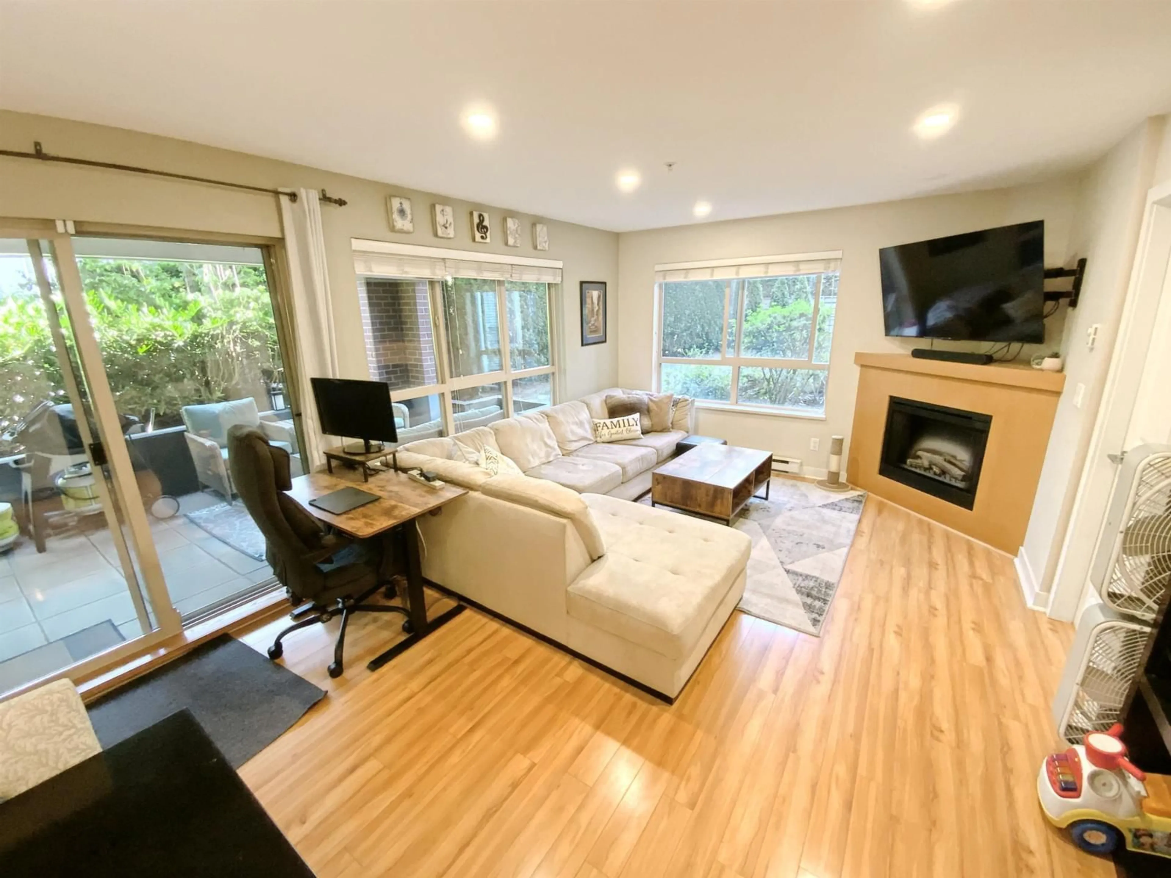 Living room with furniture, wood/laminate floor for A106 - 8929 202 STREET, Langley British Columbia V1M0B4
