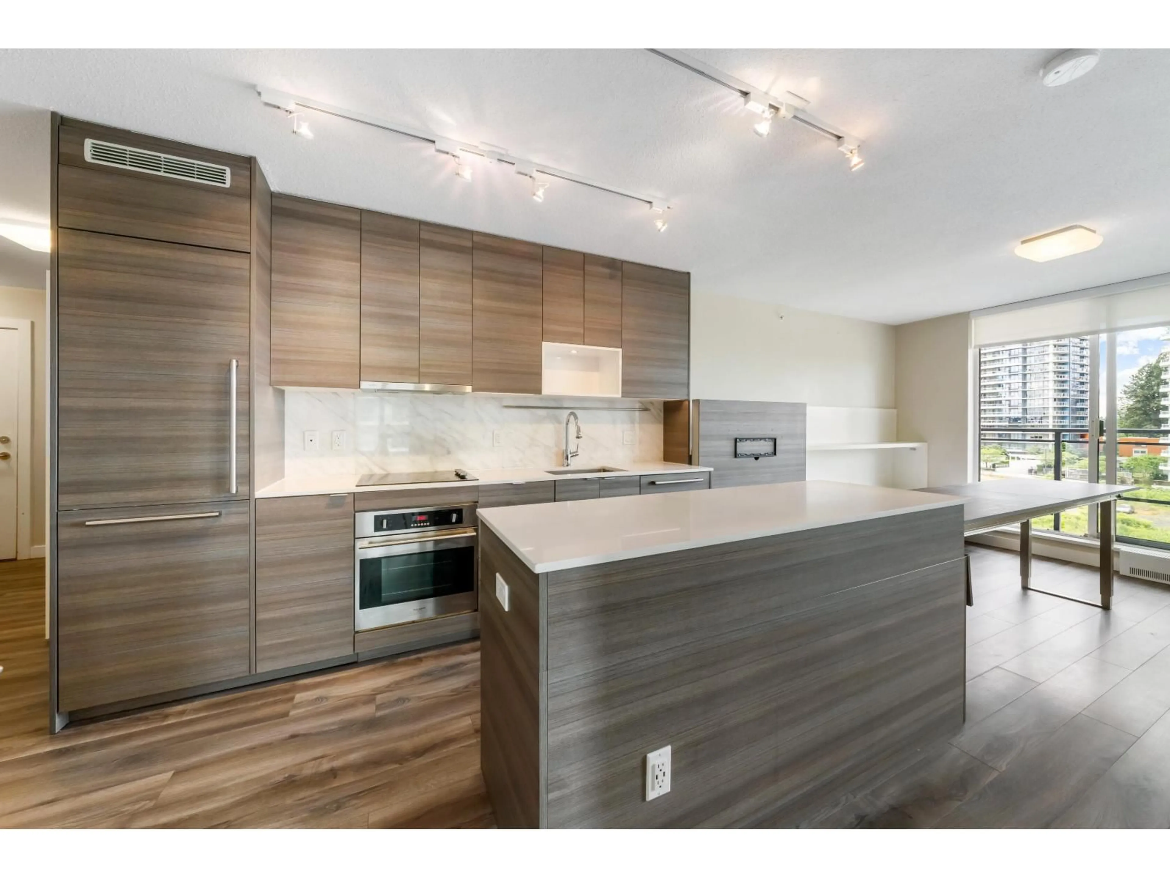 Open concept kitchen, wood/laminate floor for 805 - 13398 104 AVENUE, Surrey British Columbia V3T1V6