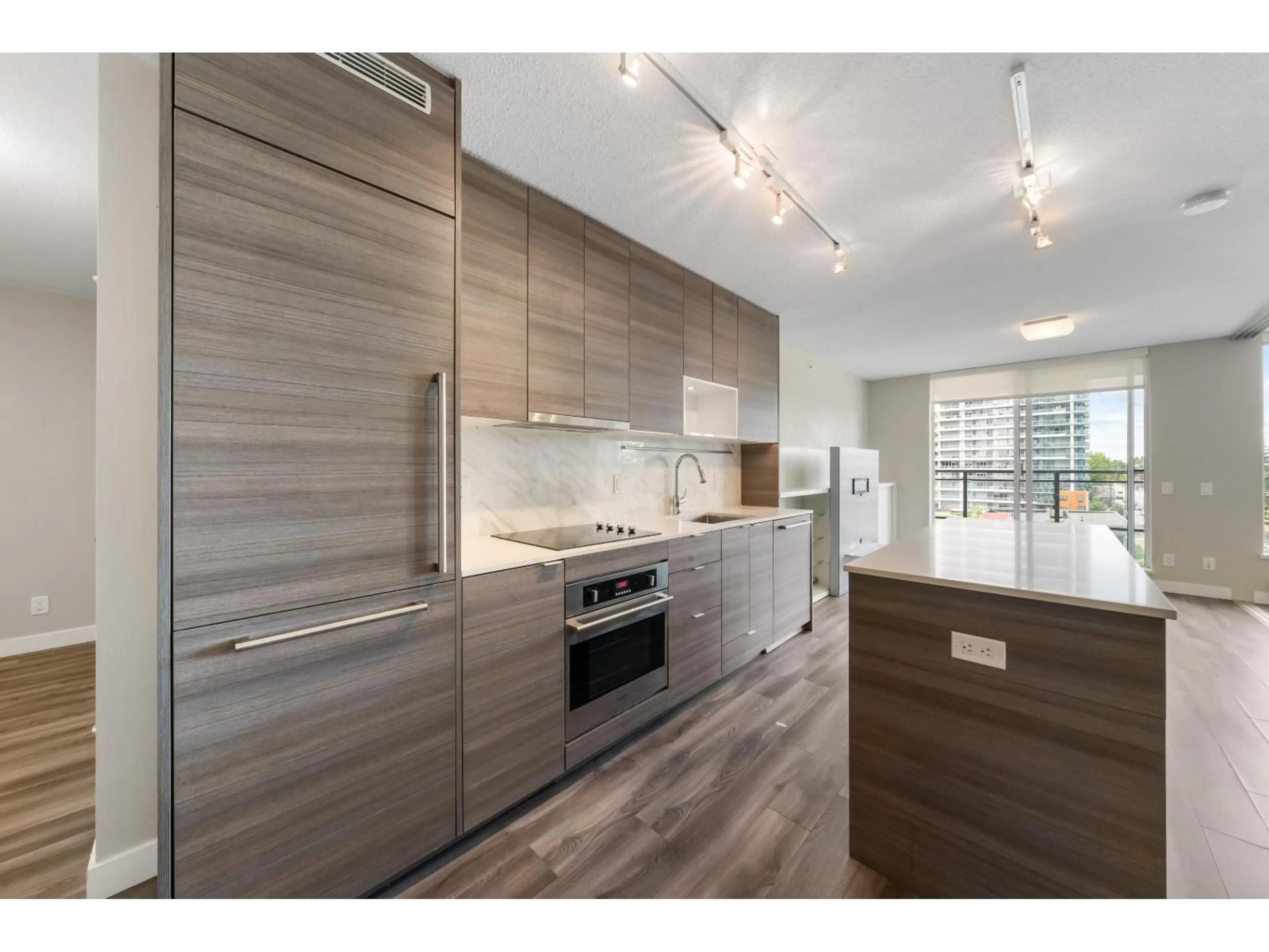 Open concept kitchen, wood/laminate floor for 805 - 13398 104 AVENUE, Surrey British Columbia V3T1V6