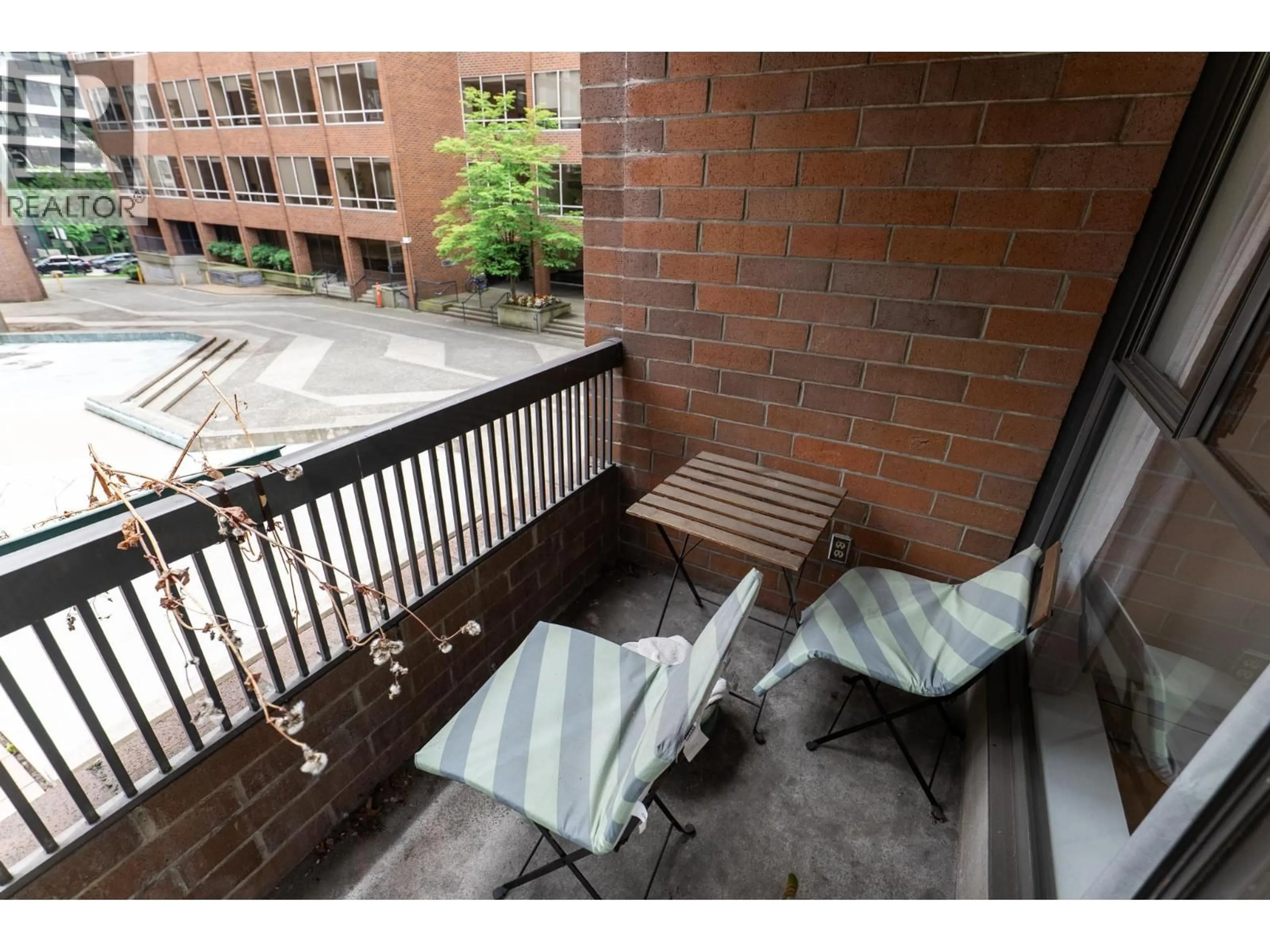 Patio, city buildings view from balcony for 214 - 1330 BURRARD STREET, Vancouver British Columbia V6Z2B8