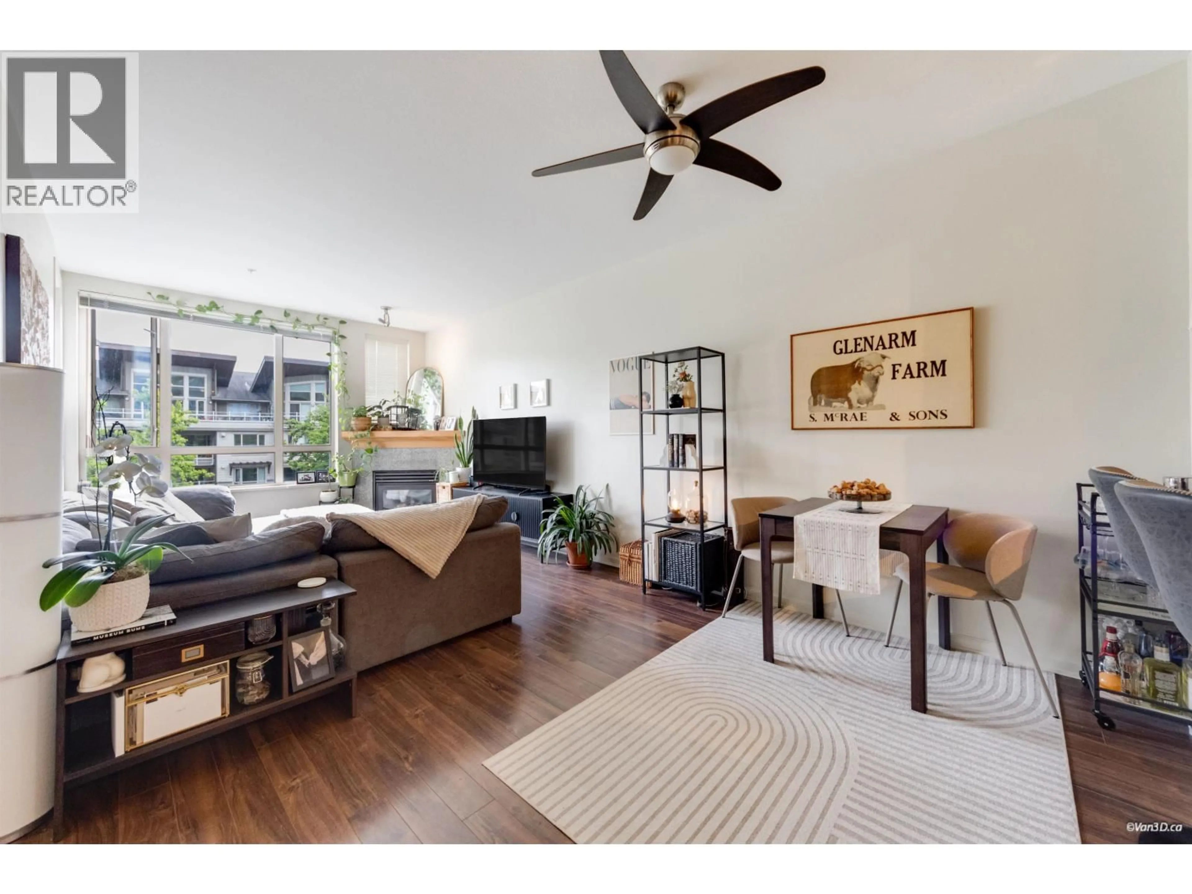 Living room with furniture, wood/laminate floor for 319 - 580 RAVEN WOODS DRIVE, North Vancouver British Columbia V7R3P4