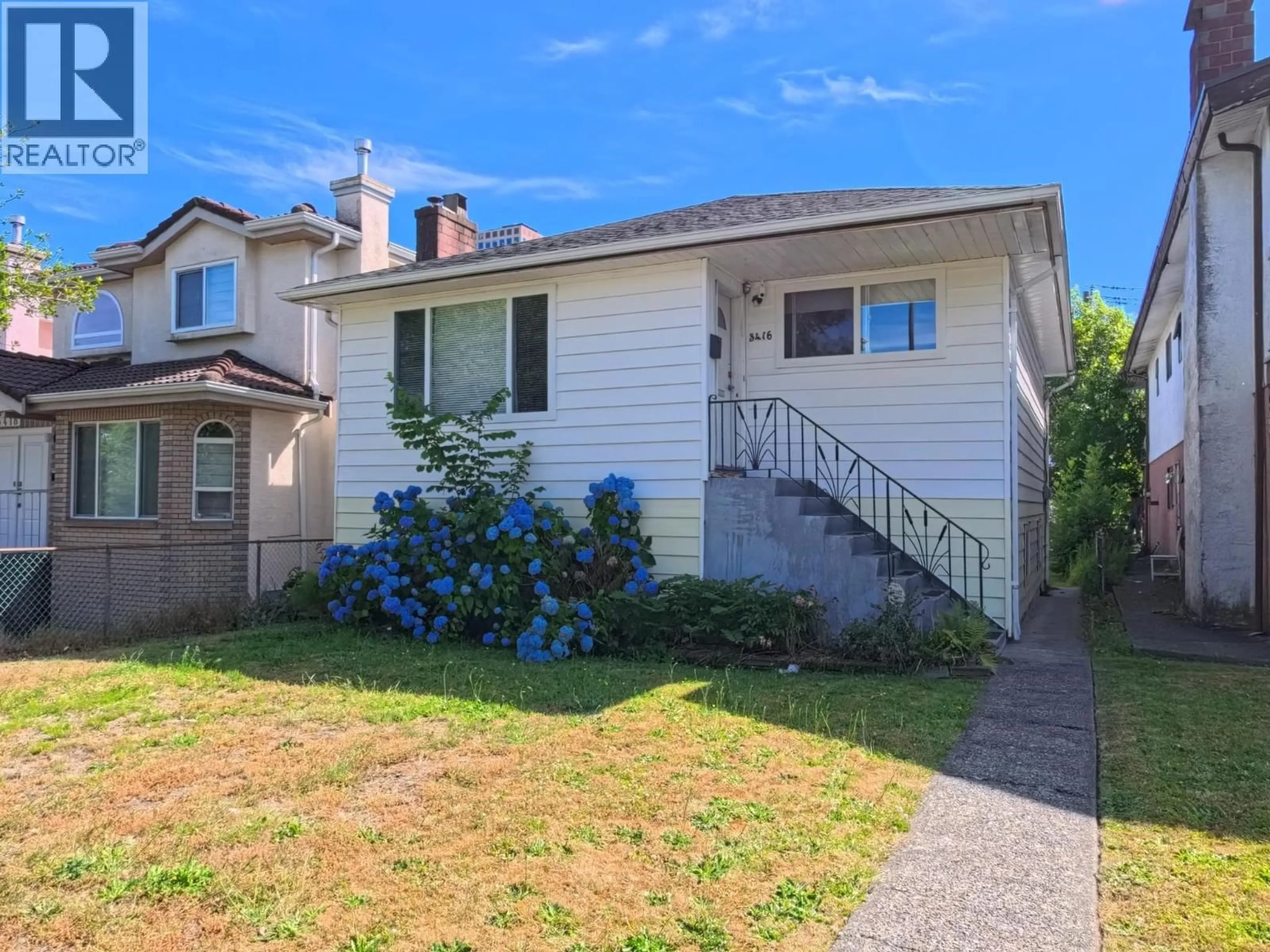 Home with vinyl exterior material, street for 3416 MONMOUTH AVENUE, Vancouver British Columbia V5R5R9