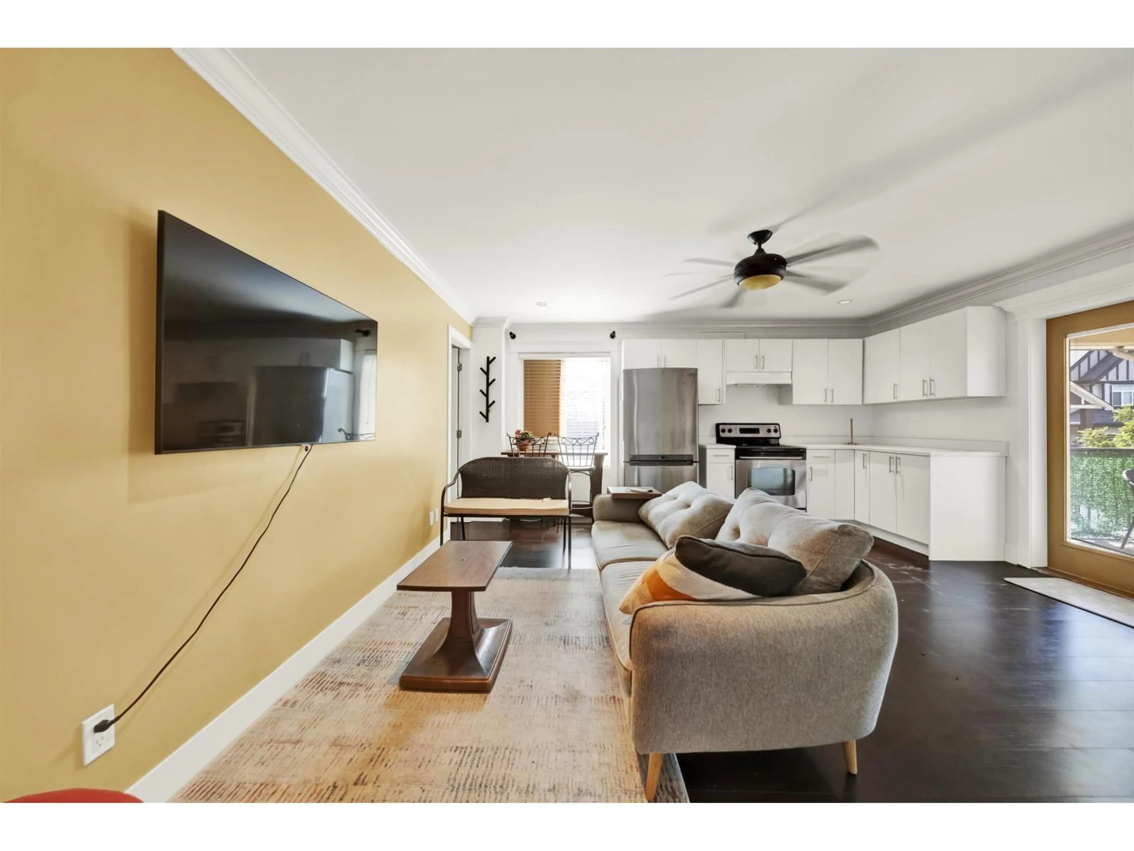 Living room with furniture, wood/laminate floor for 14511 81 AVENUE, Surrey British Columbia V3S2T9
