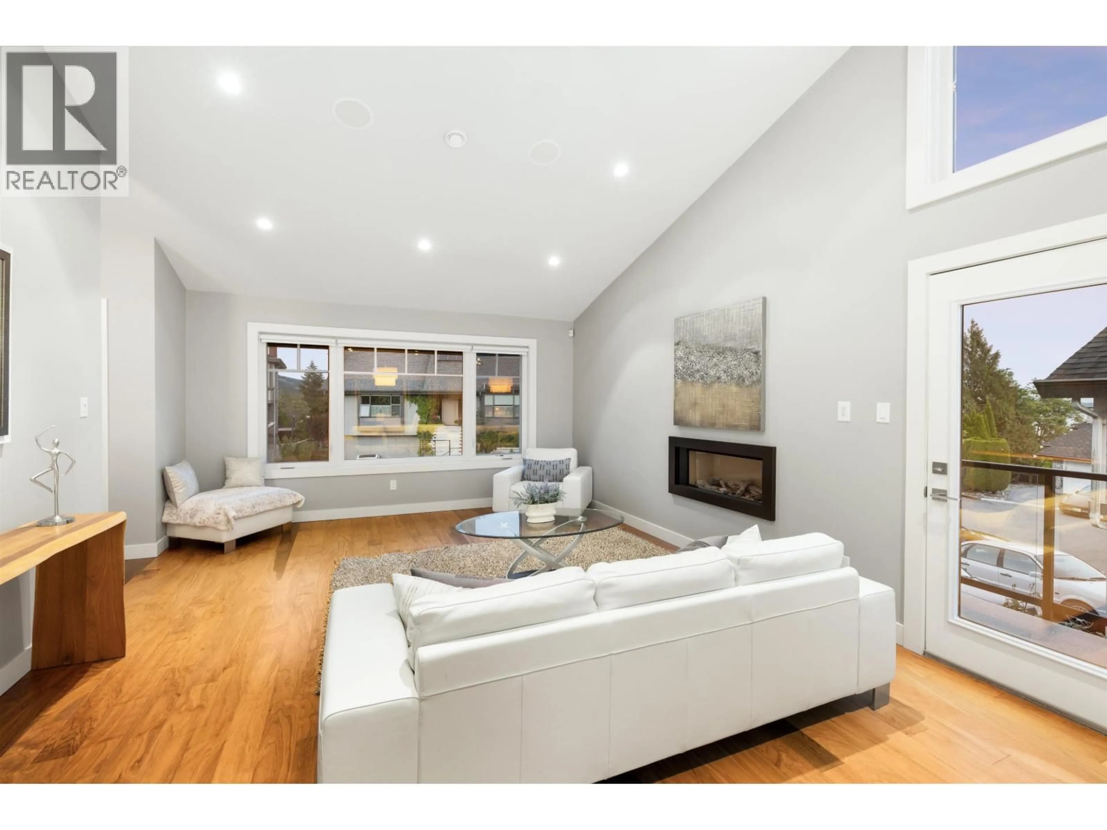 Living room with furniture, wood/laminate floor for 4786 MEADFEILD COURT, West Vancouver British Columbia V7W2Y3
