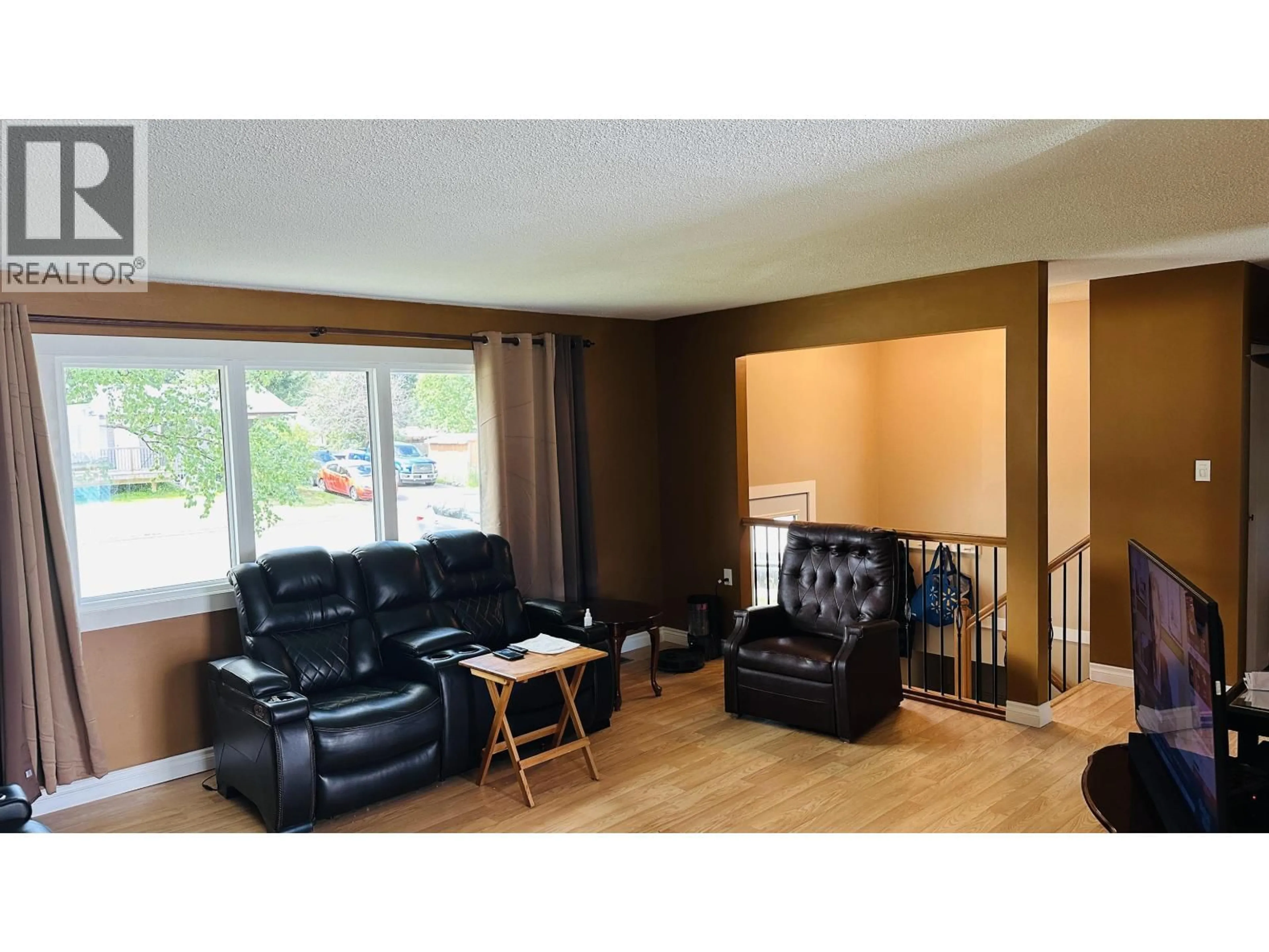 Living room with furniture, wood/laminate floor for 7656 LEMOYNE PLACE, Prince George British Columbia V2N3A7