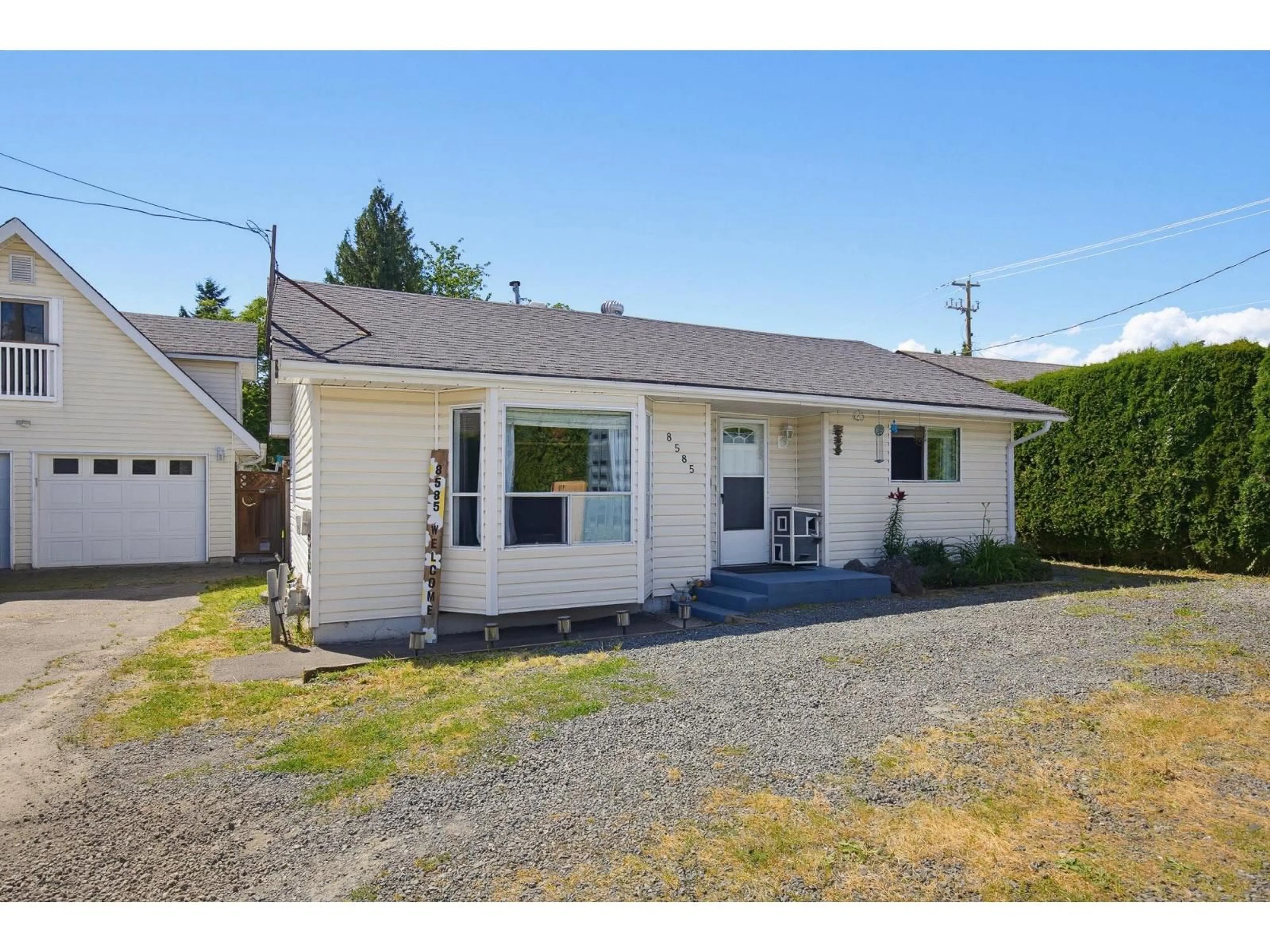 Home with vinyl exterior material, street for 8585 BROADWAY STREET, Chilliwack British Columbia V2P5V4
